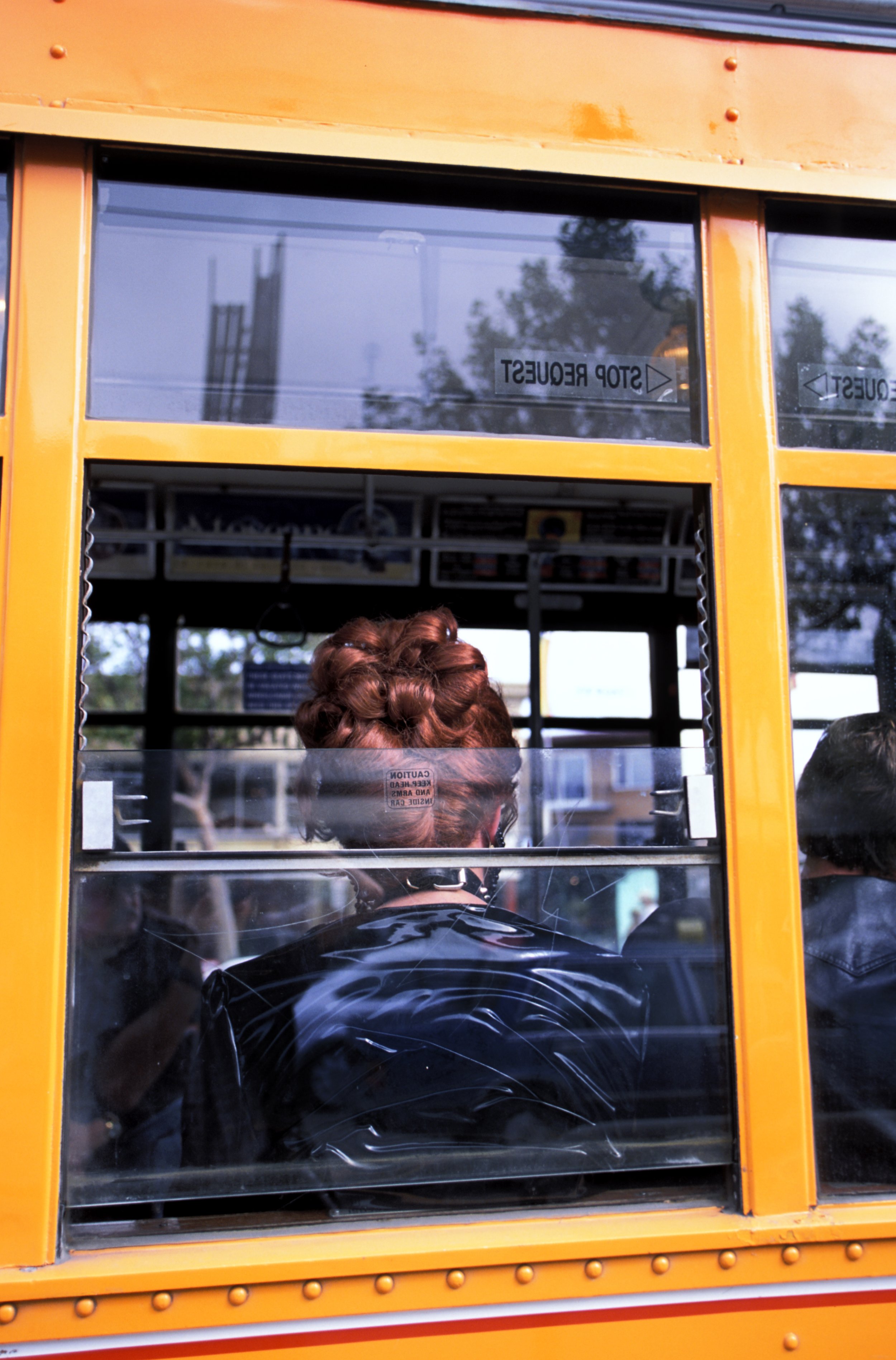  Woman with a bouffant on an old-time trolley in San Francisco. 2002 