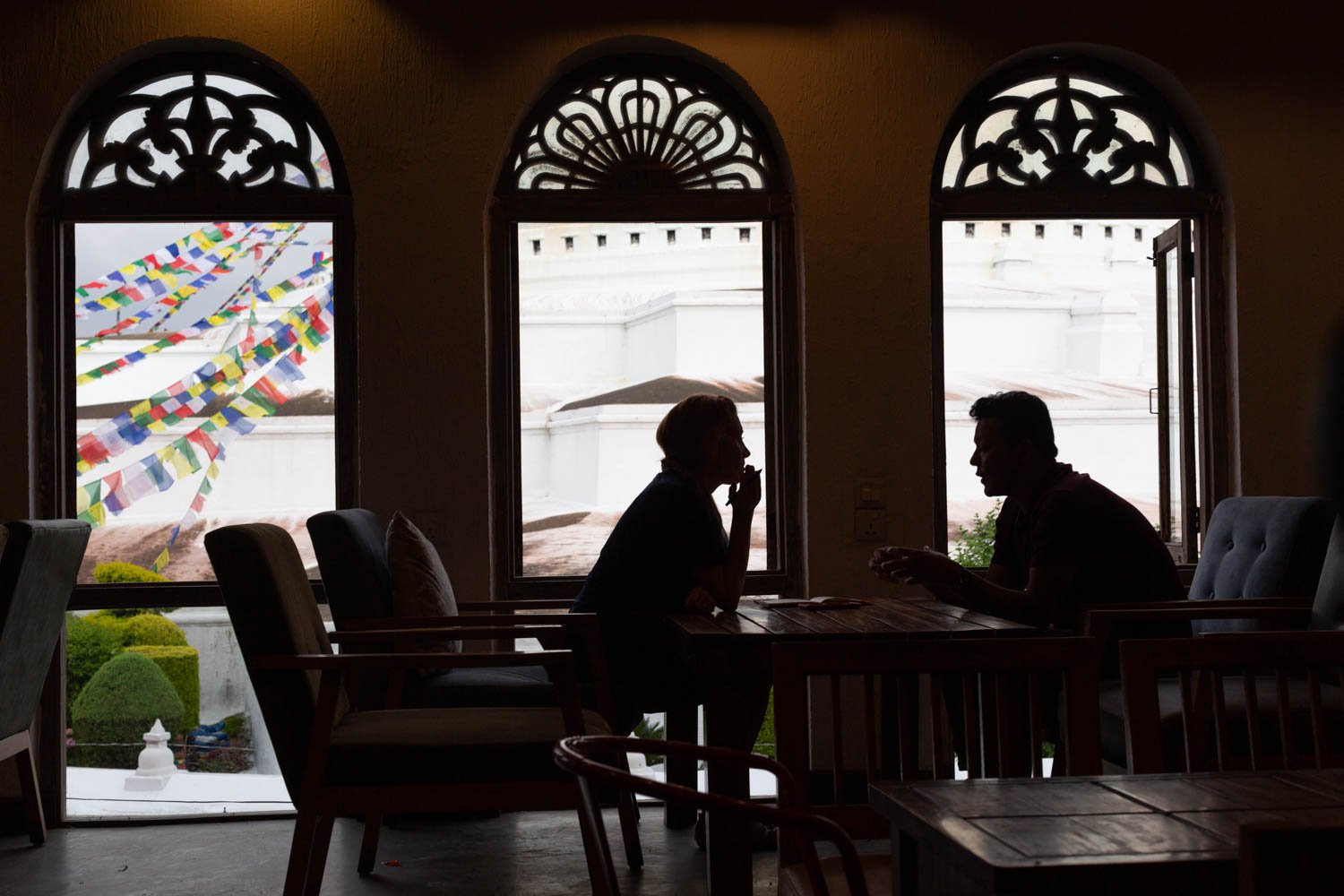  TIME correspondent Aryn Baker interviews an anonymous worker activist at a cafe in Kathmandu, Nepal on June 26, 2022.  The activist worked in Qatar for years before coming back to Nepal. 