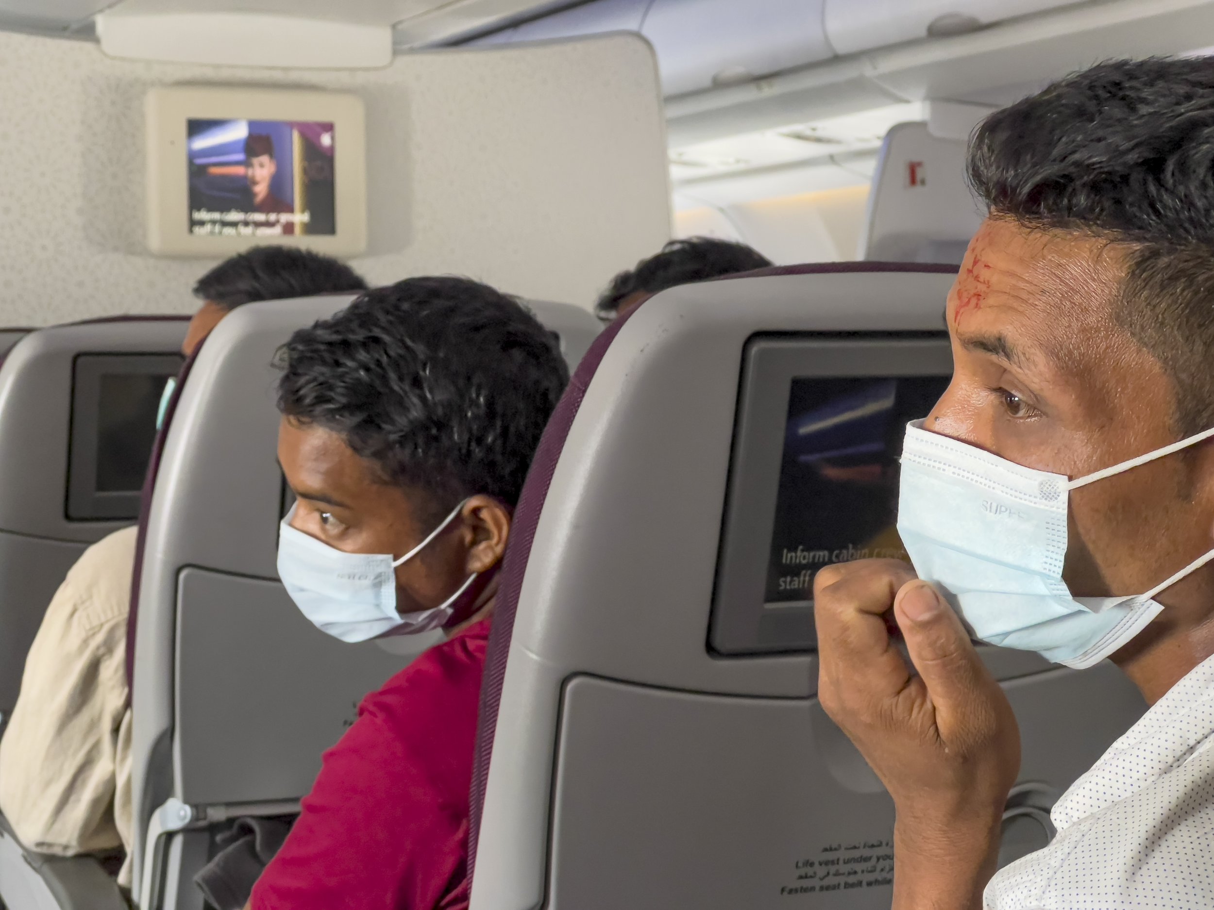  Nepali workers on a Qatar Airways flight from Kathmandu to Doha on July 4, 2022. 