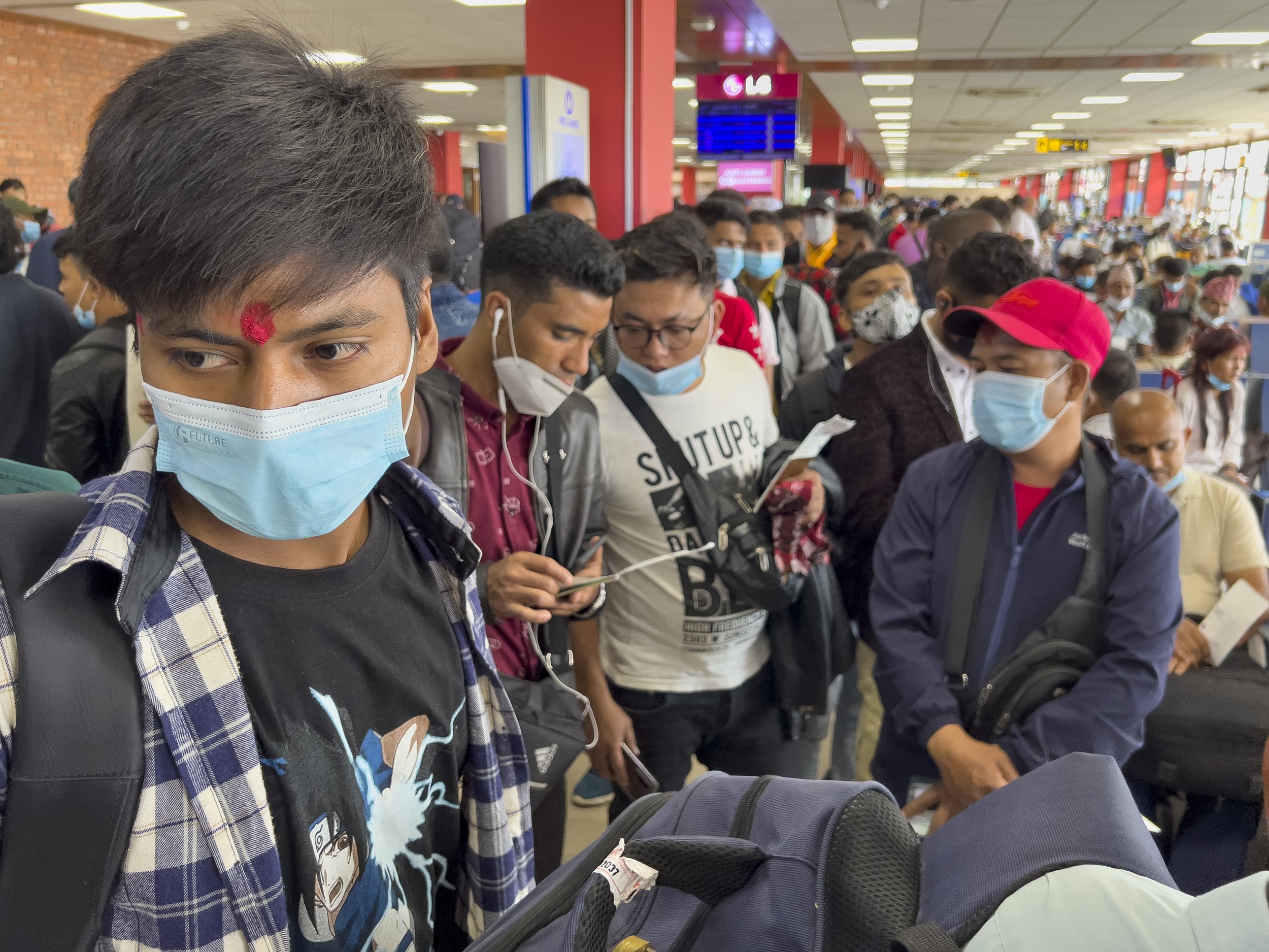  Nepali workers waiting at the airport to board a Qatar Airways flight from Kathmandu to Doha on July 4, 2022. 