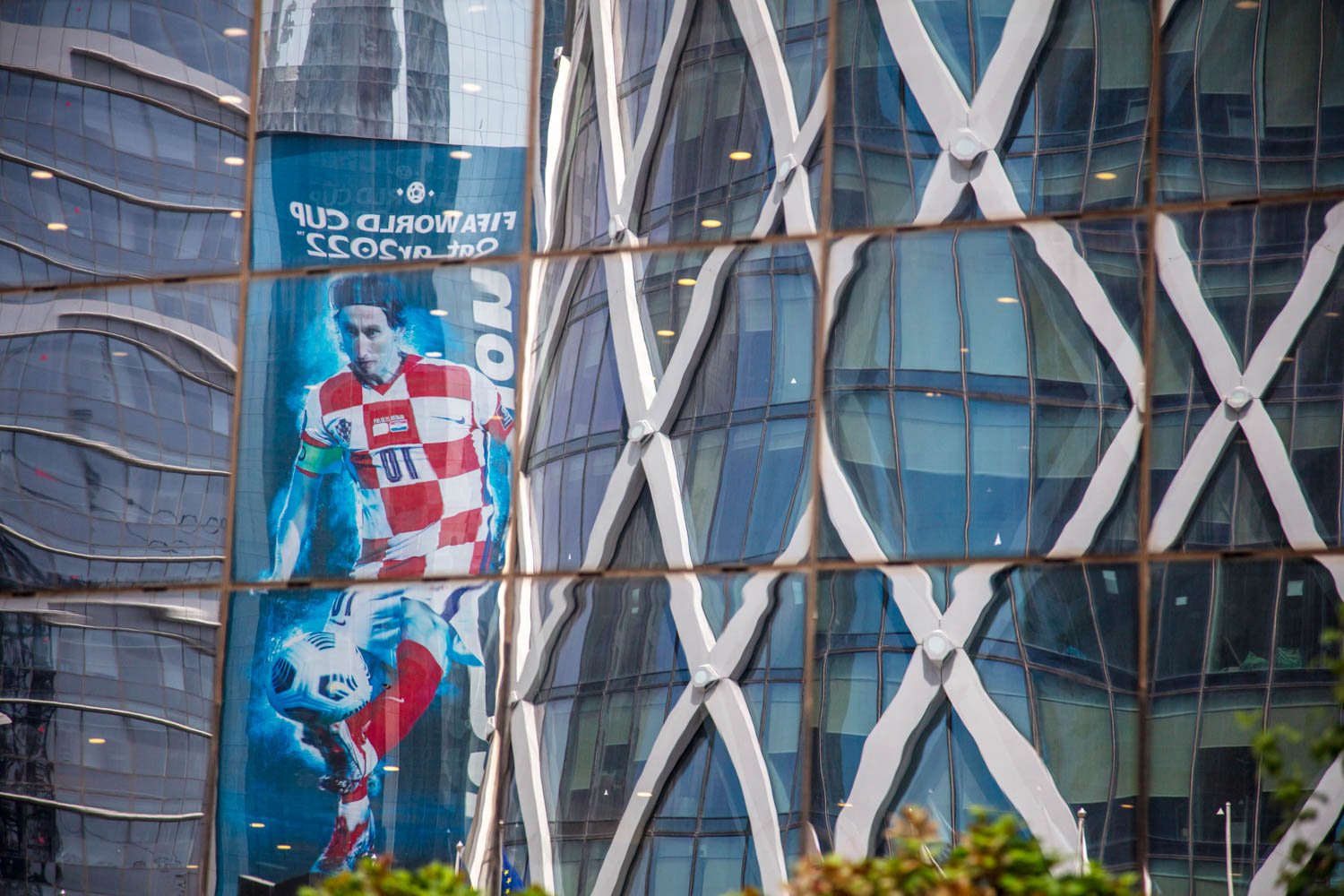  Views of a modern skyscraper and a World Cup billboard in Doha, Qatar on August 16, 2022. 