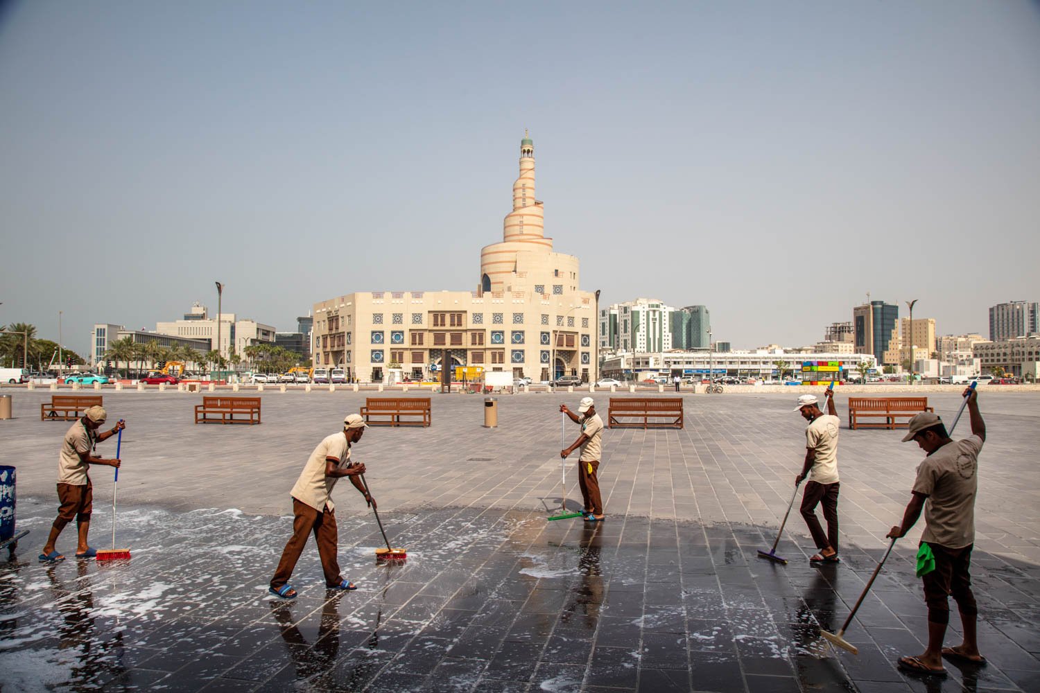  Foreign workers, mostly from Nepal, cleaning the old Souk in 120 degree heat in Doha, Qatar on August 16, 2022. 