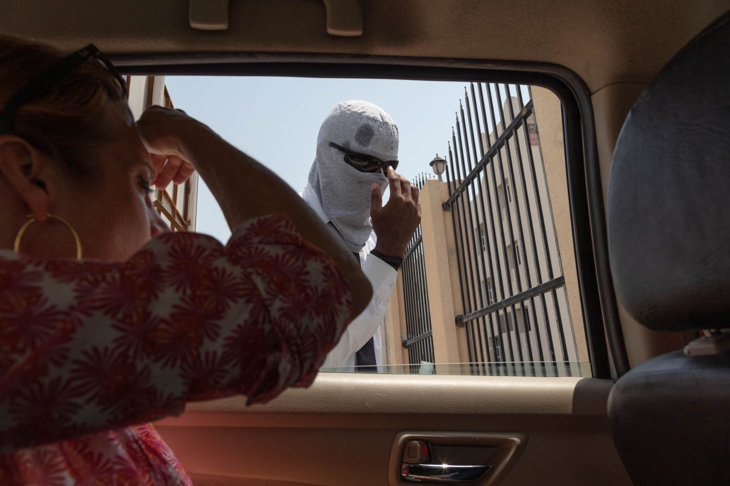  A private security guard looks into a car window in Lusail City, Qatar on August 18, 2022. 