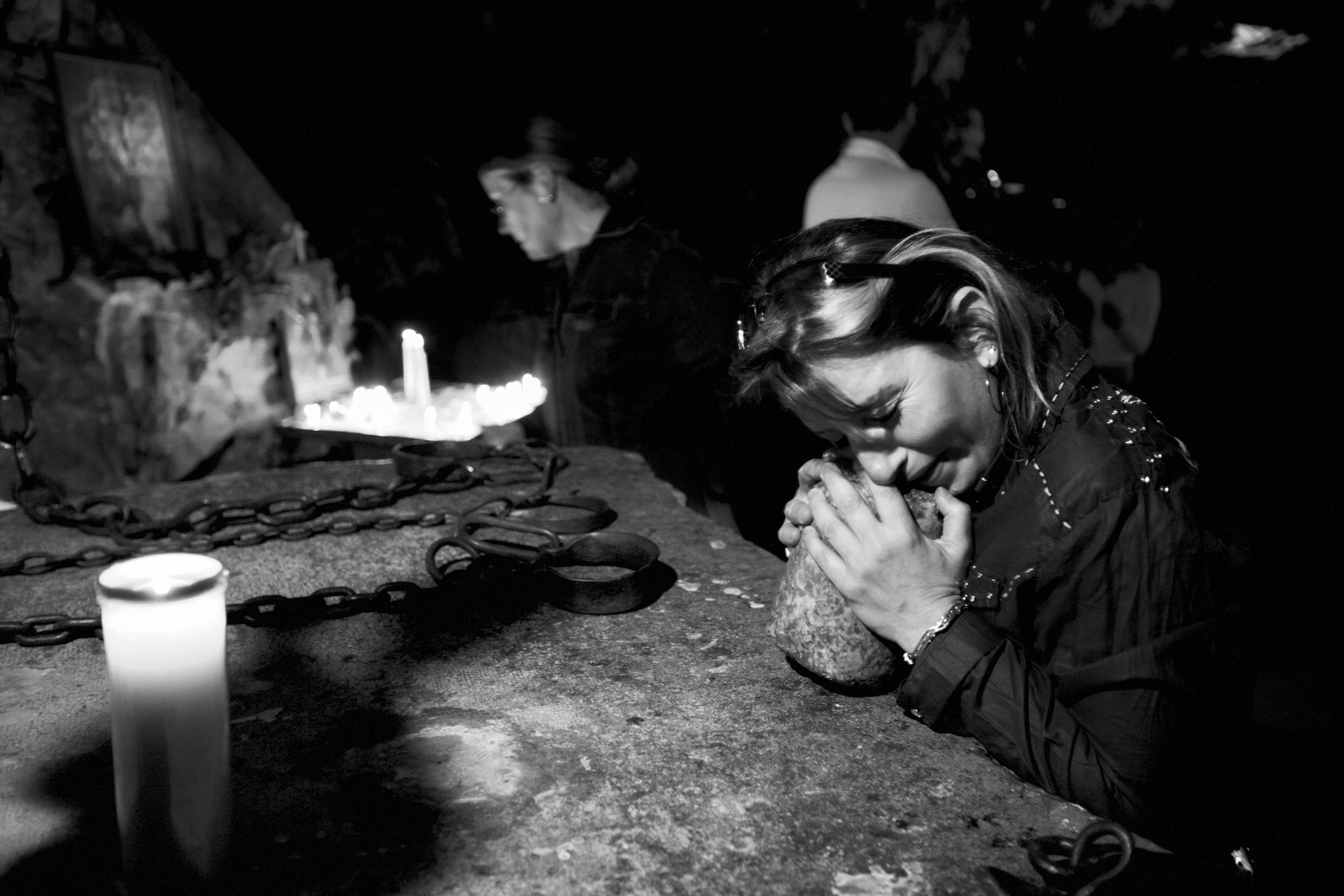  A Christian woman is overcome with emotion as she prays in the cave of the Monastery of Saint Anthony, situated in the "Holy Valley" of Qadisha, near the town of Bsharre, Lebanon on April 13, 2008. 