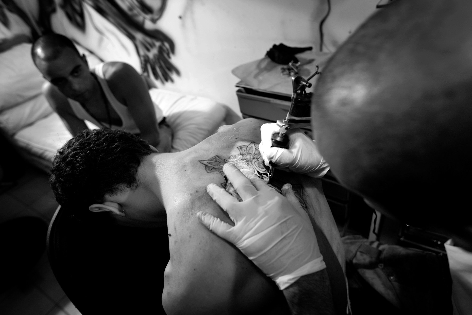  Jehad Nassif creates Christian tattoos for his clients at the Survivor Tattoo Parlor in East Beirut, Lebanon, on April 14, 2008. In this Christian section of the city, most of Nassif's clients are young people who strongly identify with their religi