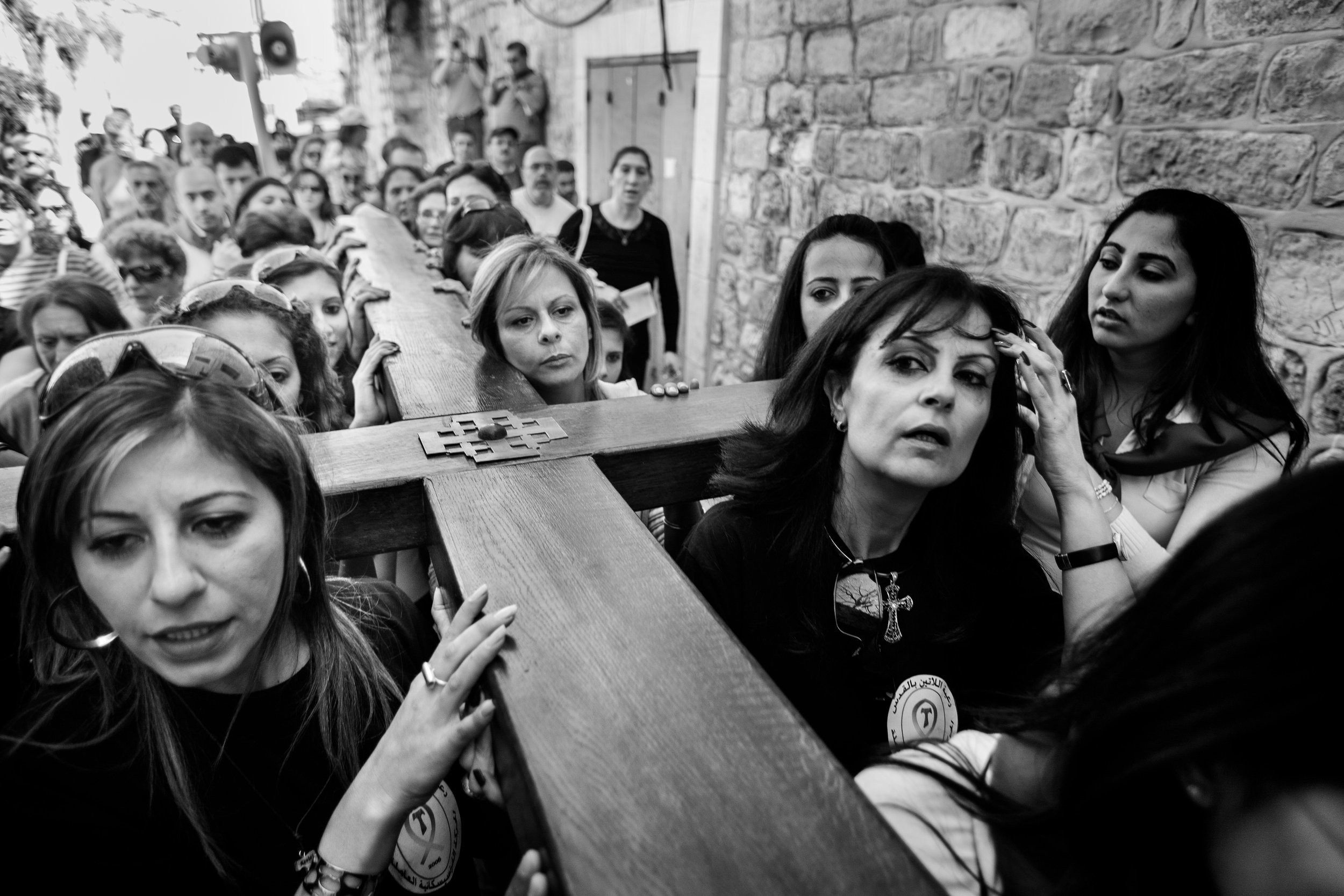  The Stations of the Cross procession for Catholic Easter in the Old City of Jerusalem. Some of the women holding the cross are Arab Catholic Scouts. 