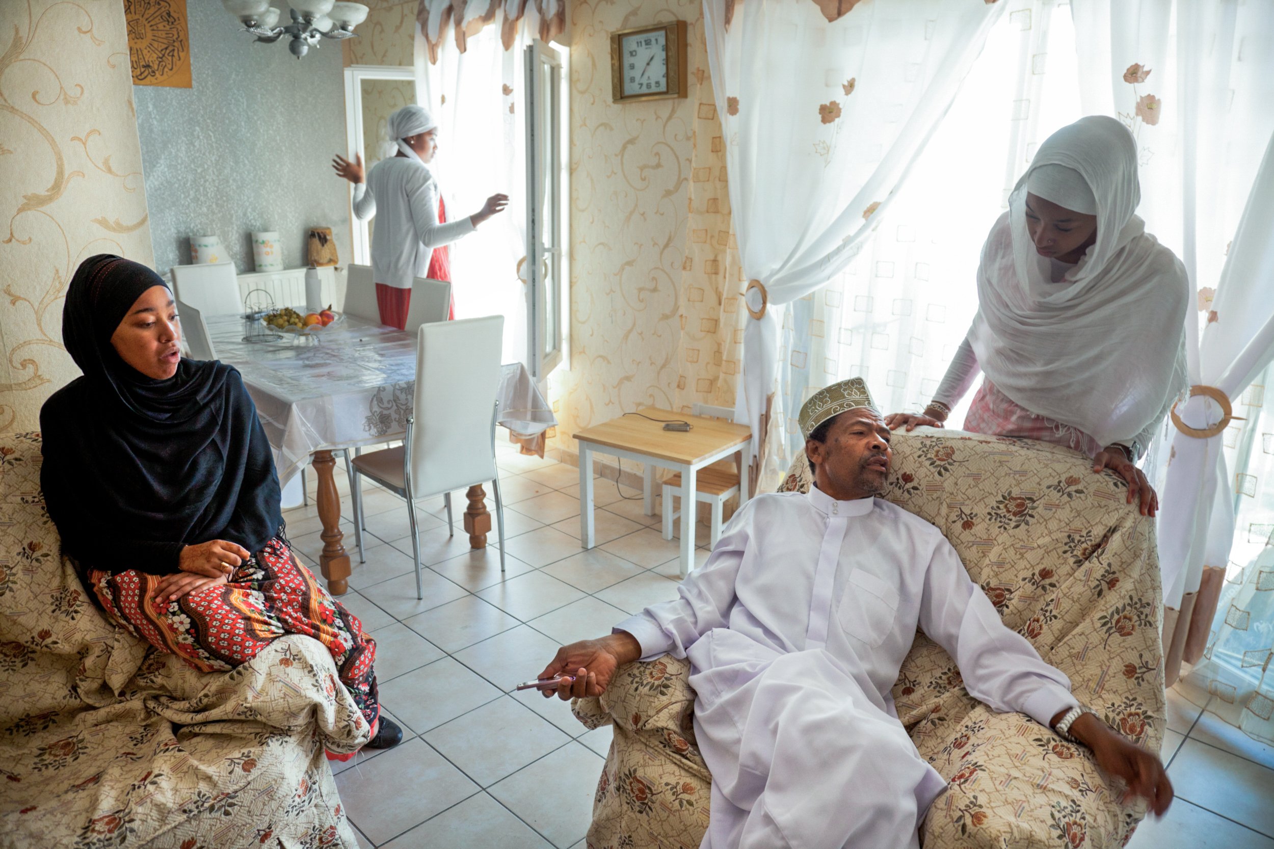  The family of Imam Maoulana Charif, of the Comorian community, sits together the day after Eid al Fitr in their home in Cite D'aou in Marseille, France on September 11, 2010. 