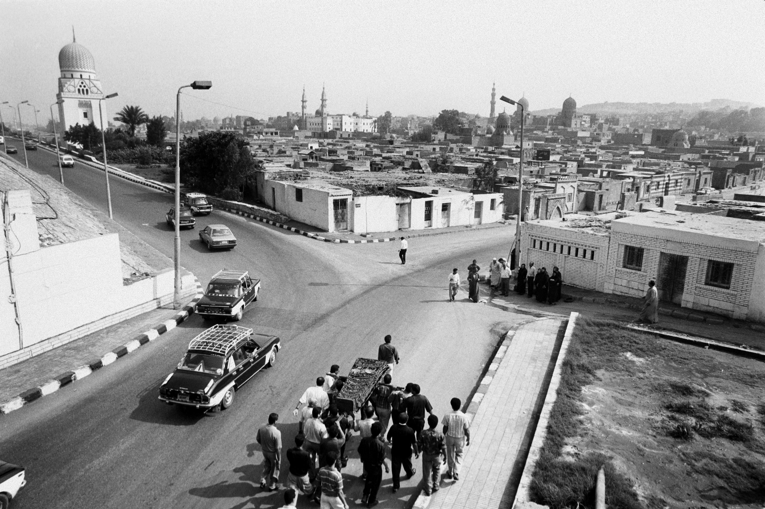  A funeral procession heads to the cemetery. 