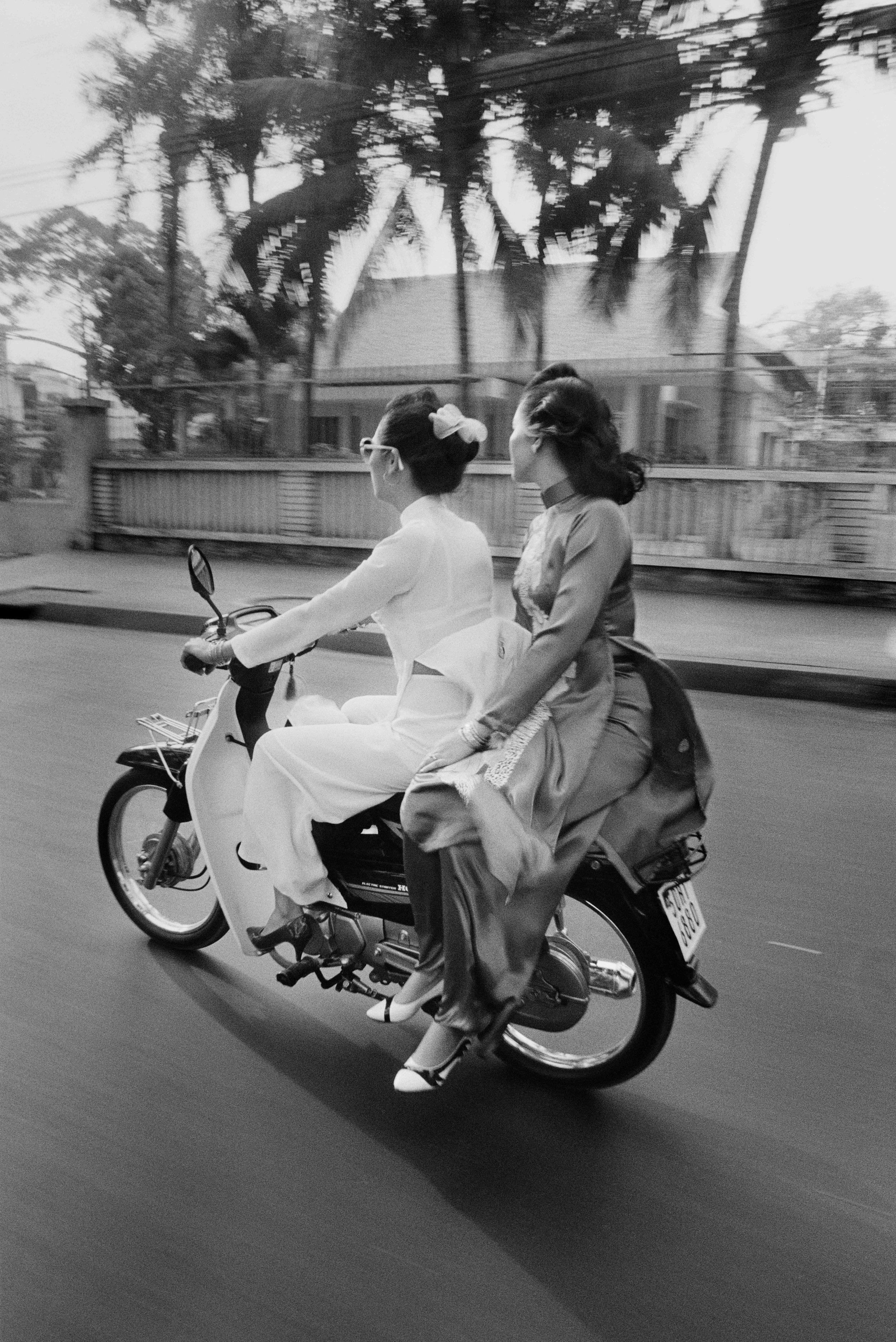  Except for the motorbike, these traditionally dressed women could be from another era of Saigon’s stylish past. 