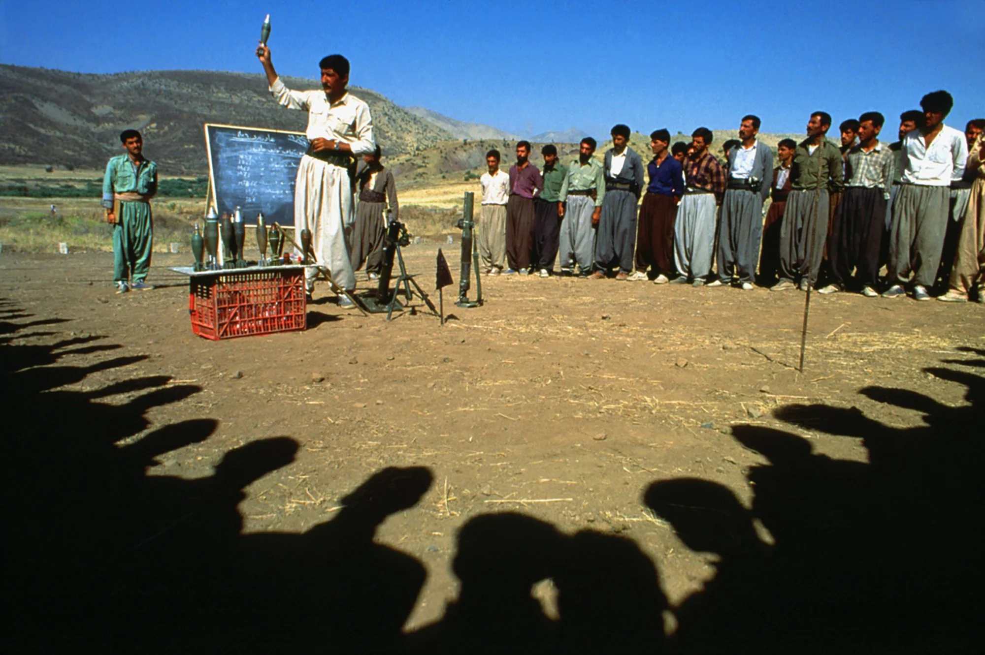 Kurdish men receive training in Chalacholan, Iraq on July 8, 1991. These men are new recruits for the Pesh Merga, or "those who face death".