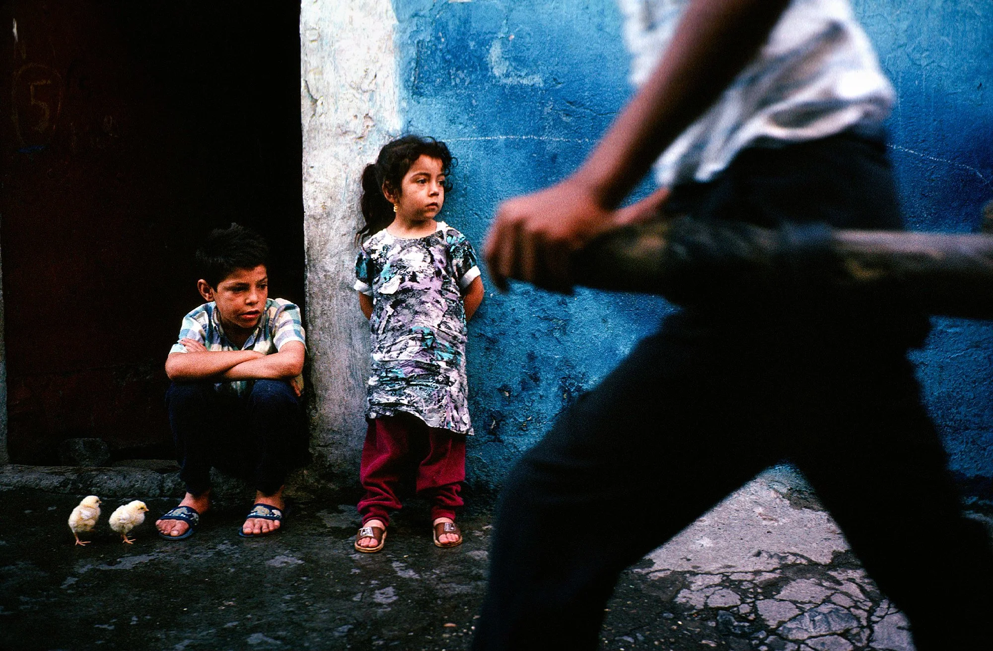 Kurdish children in an early morning scene among the back alleys of the ancient city of Diyarbakir, Turkey, 1991.