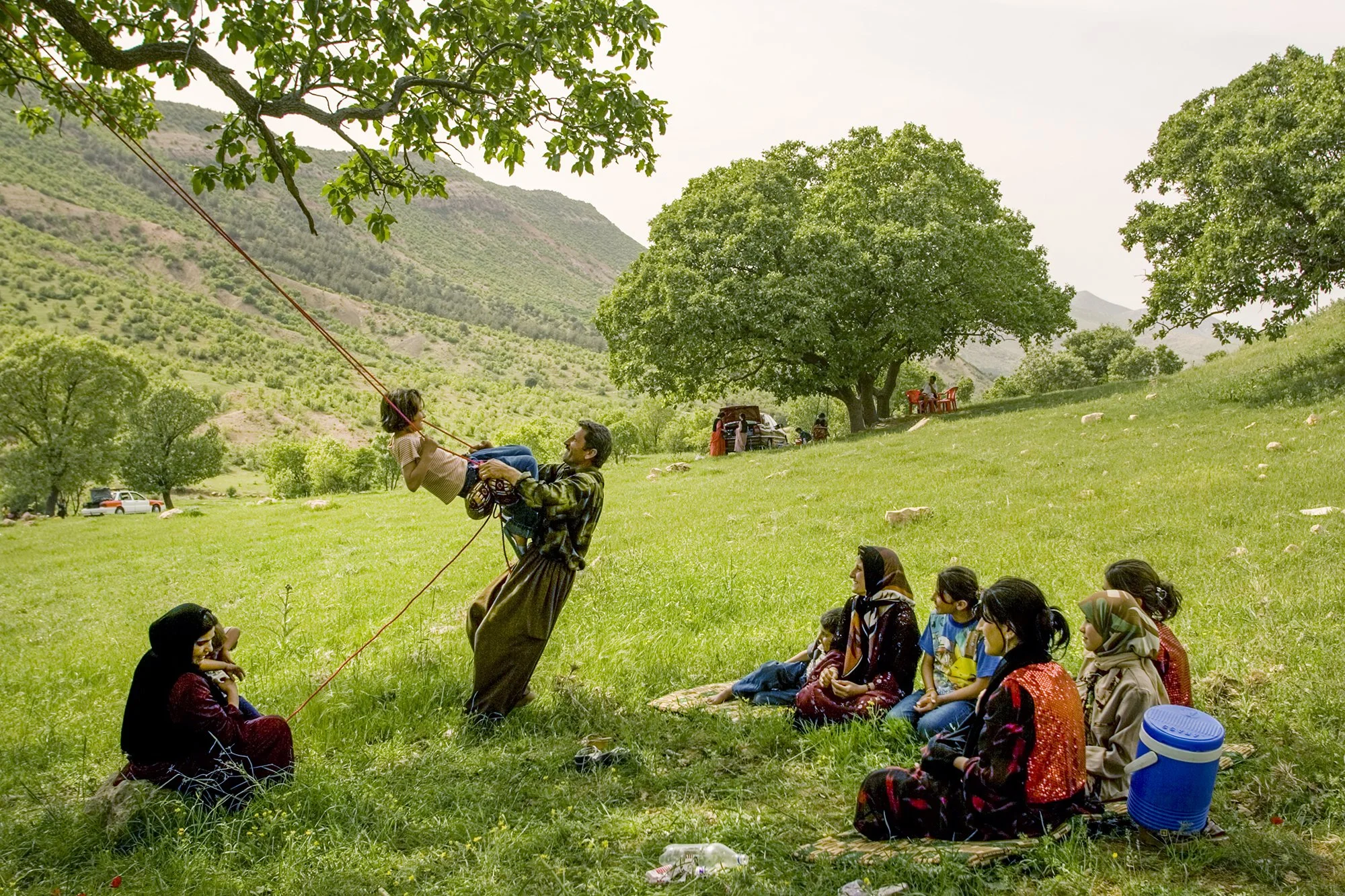 A family relaxes together during a picnic in Shaqlawa, Iraq on April 21, 2005. Every Friday, the family comes to the same mountains where Kurdish guerrillas fought the Iraqi army a generation ago.