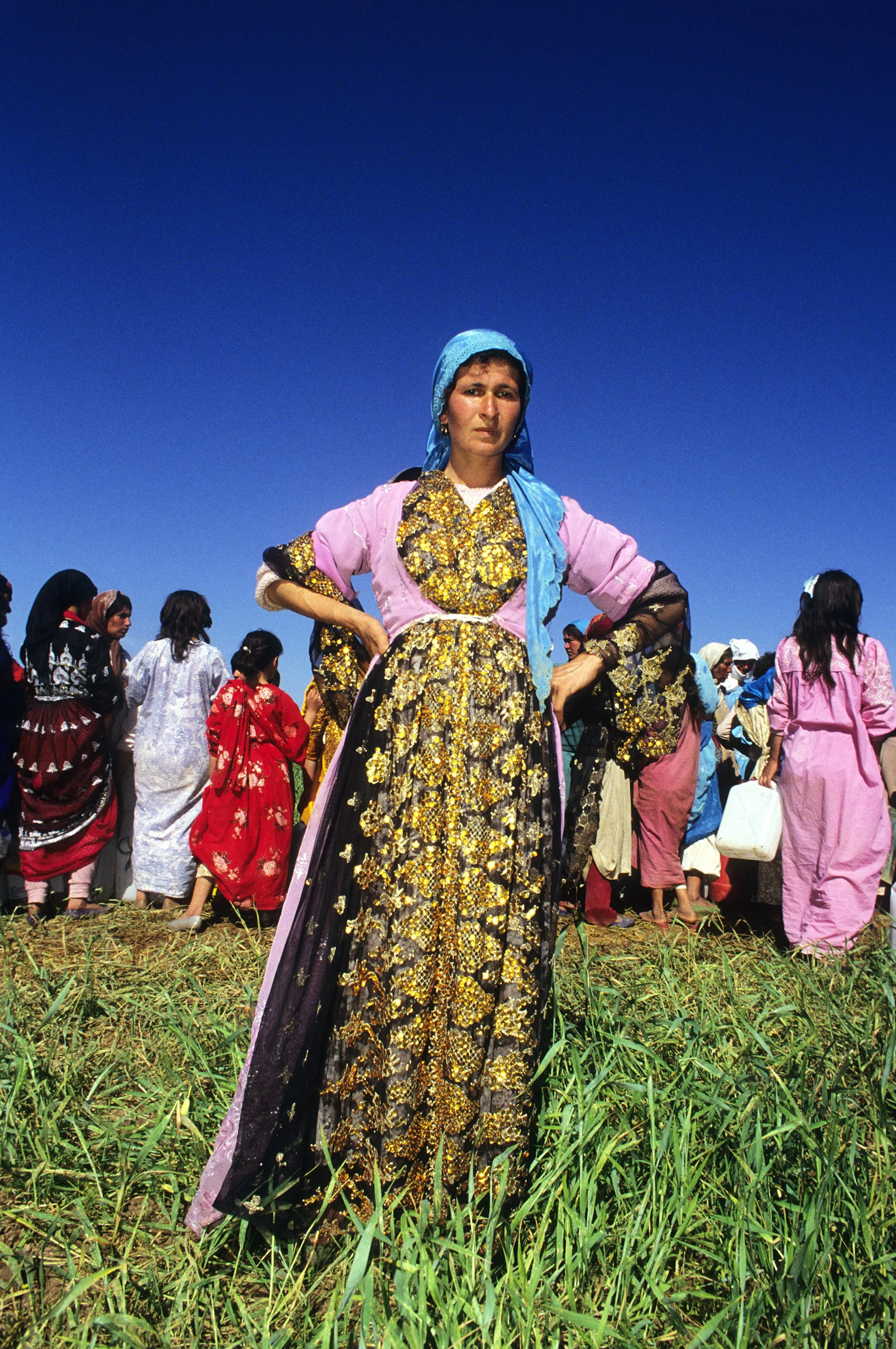 A Kurdish refugee arrives to a camp to receive water in Zakho, Iraq on July 14, 1991. This United States run camp was home to 4,000 Kurdish refugees following the Gulf War.