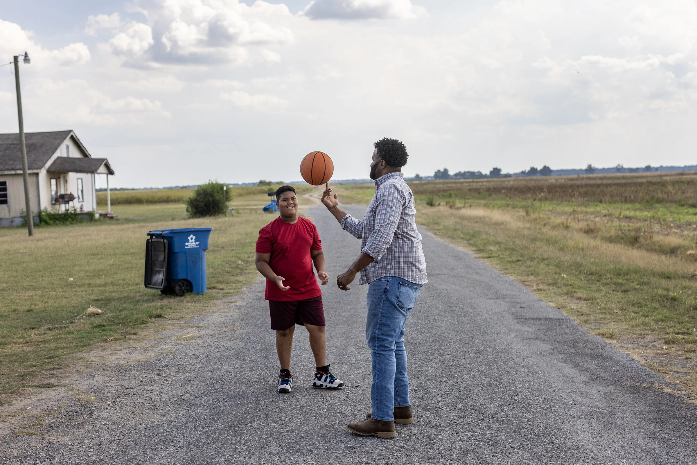  Robert Miller plays basketball with 11-year-old Eli Neese, a boy he mentors, in Friars Point, Mississippi on September 10, 2025.  
