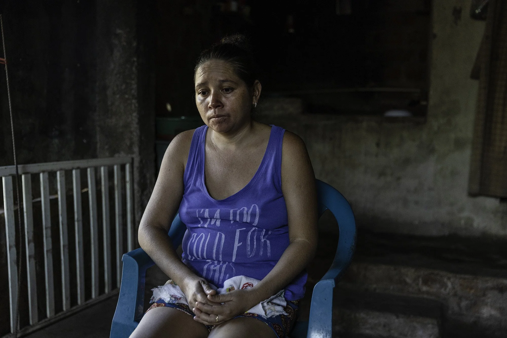  Blanca Rosa, 35, lost her son, Cesar Omar Flores Fuentes, 20, to  CKDnT, chronic kidney disease of non- traditional causes, three months ago, photographed at her home in Canton Colima, El Salvador on March 7, 2026. 