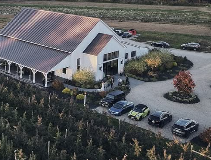 white barn wedding venue surrounded by orchard in NH