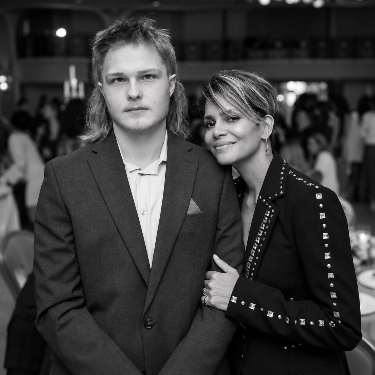Two guests posing together at a Looking Beyond charity event.png