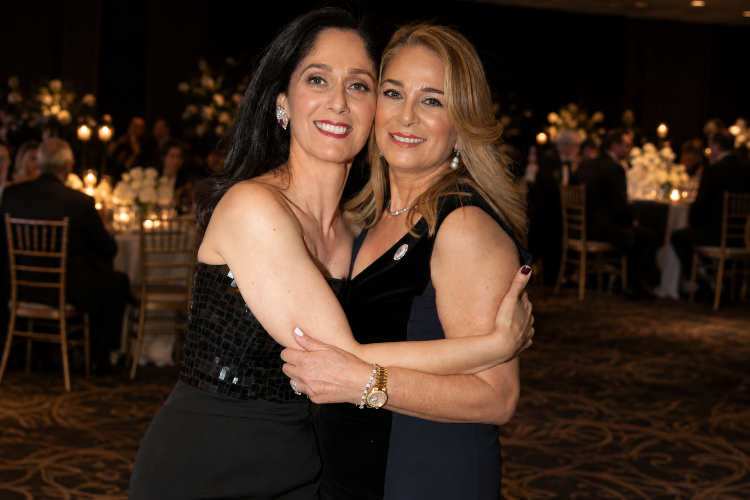 04-two-women-embracing-at-gala.png