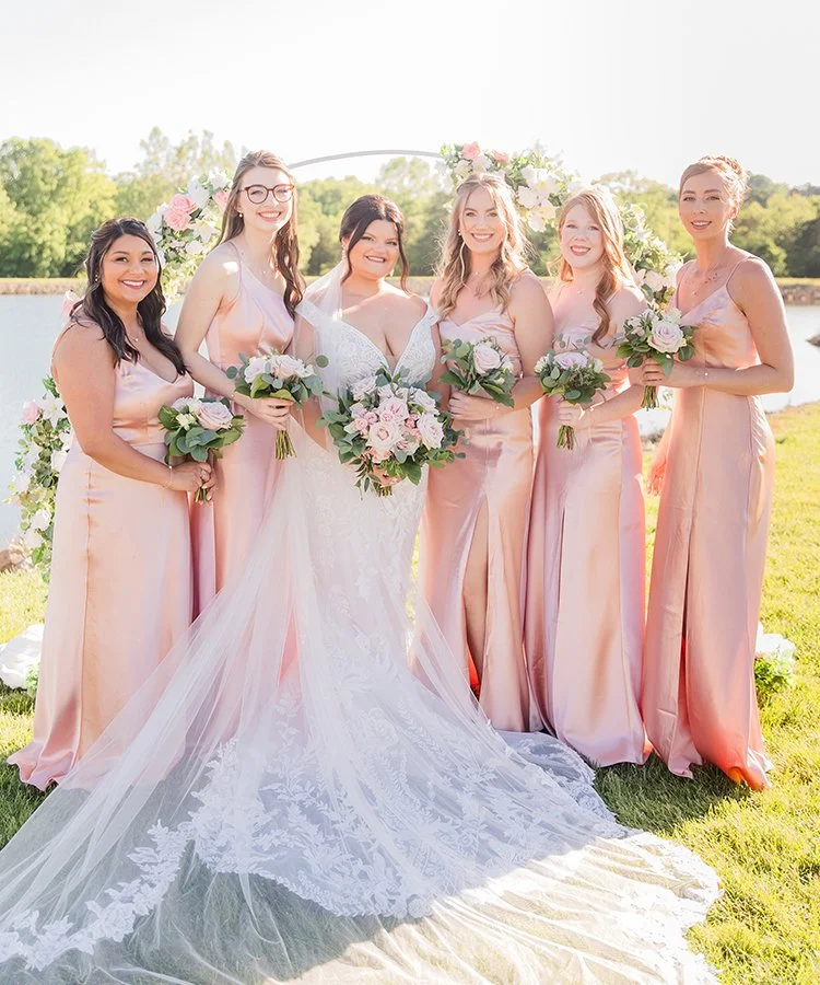 Bridesmaids and bride holding Blush Garden  bouquets designed by St. Louis florist, The Flower Lab.