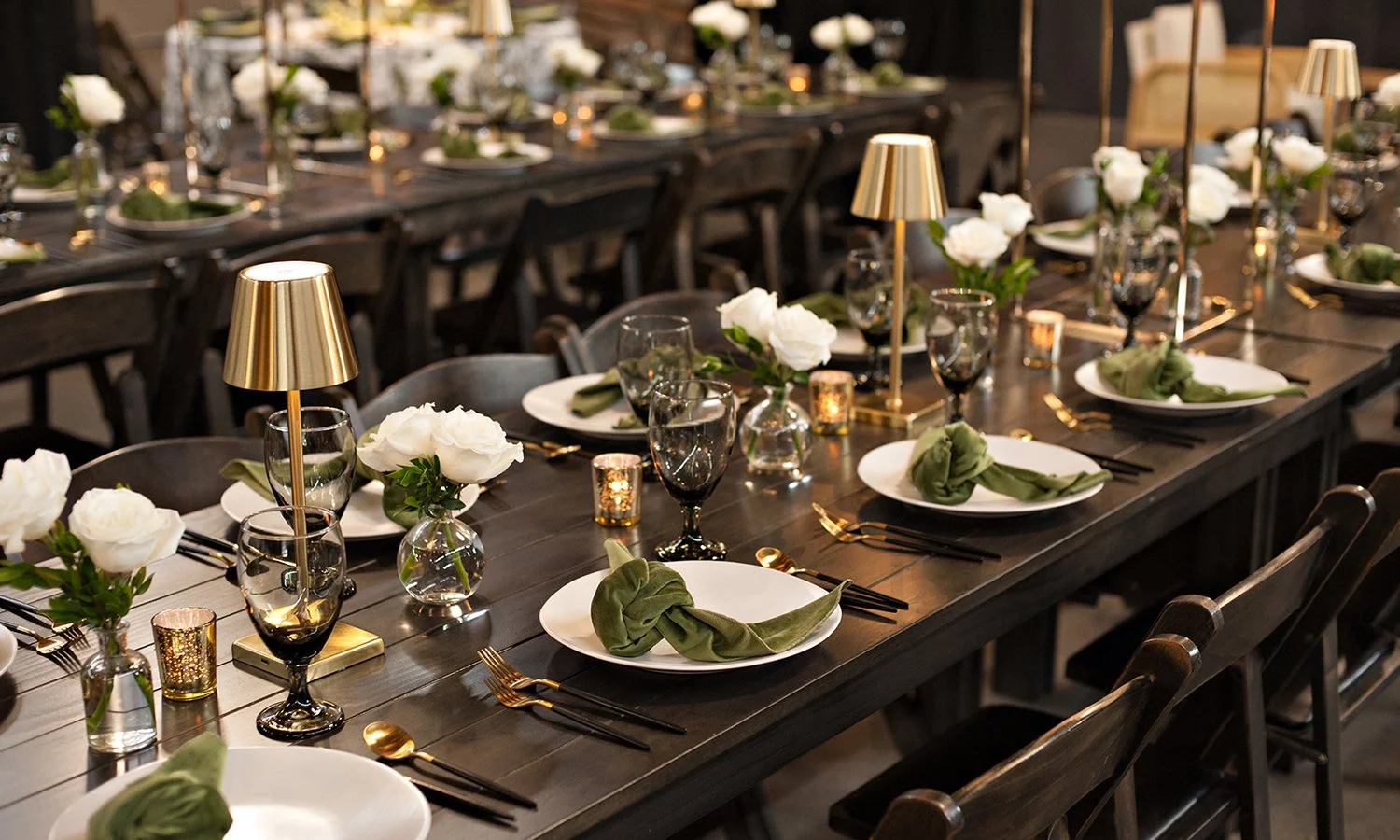 White rose bud vases on a rehearsal dinner table in St. Louis.