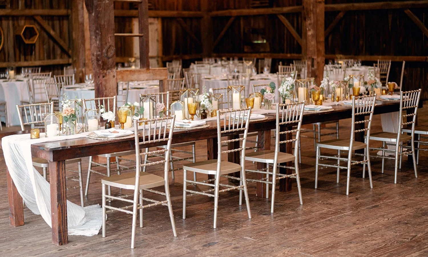 Guest table for a wedding welcome party with bud vases by The Flower Lab in St. Louis.