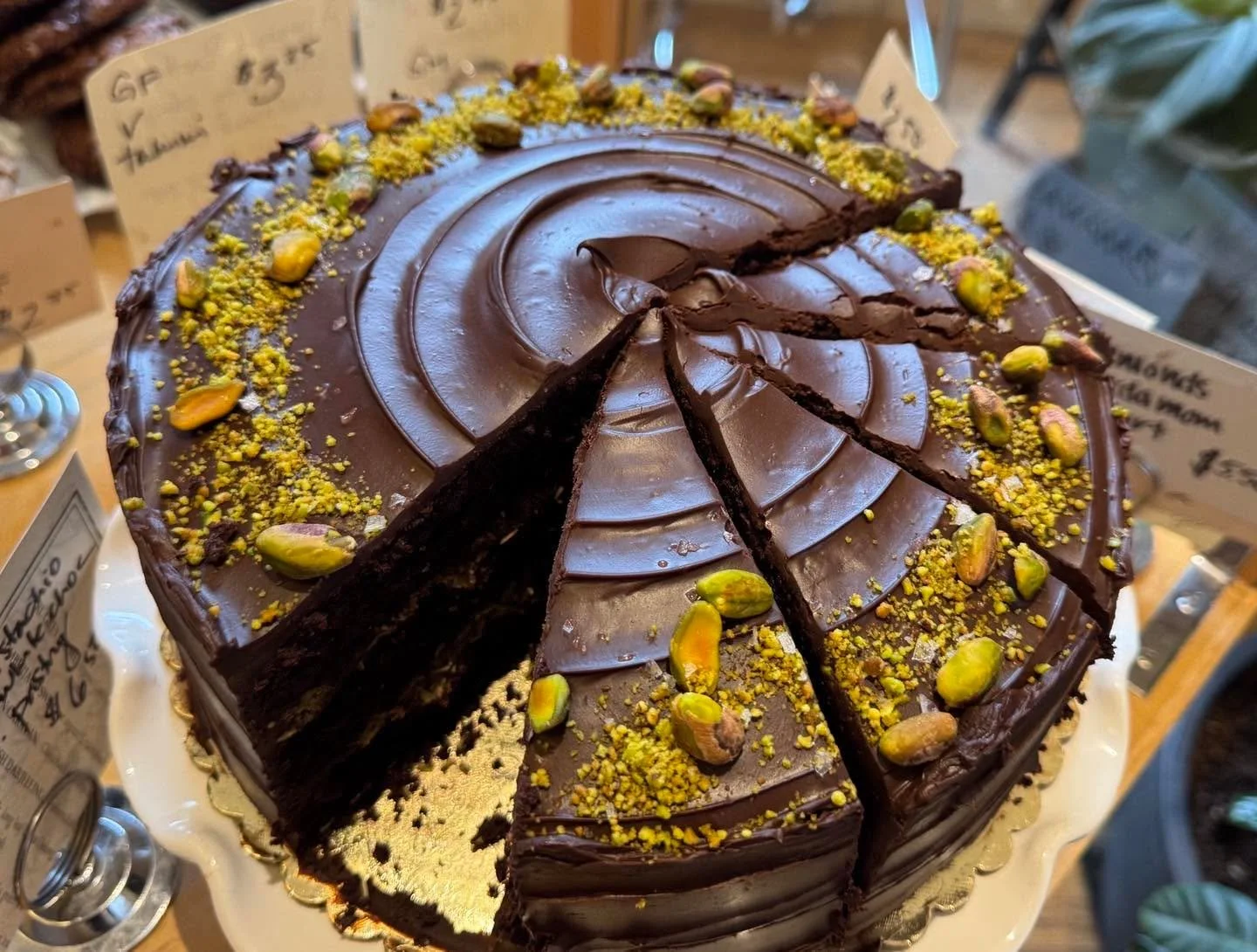 Going international today with a Dubai chocolate cake. Devils food cake, chocolate ganache, a caramelized white chocolate and pistachio butter AND kadayif filling. Topped with ground AND whole pistachios. Oh my!! #dubaichocolate