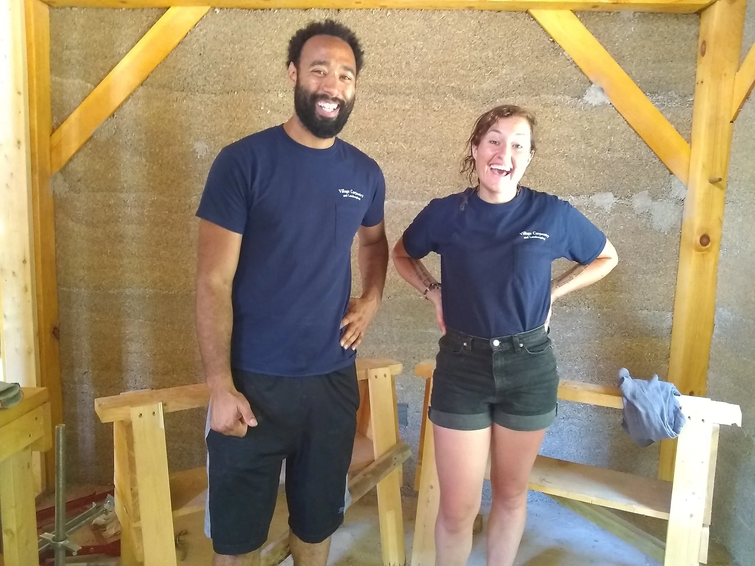 Kirin and Melissa, hempcrete mixer and packing crew members at Village Carpentry and Landscaping