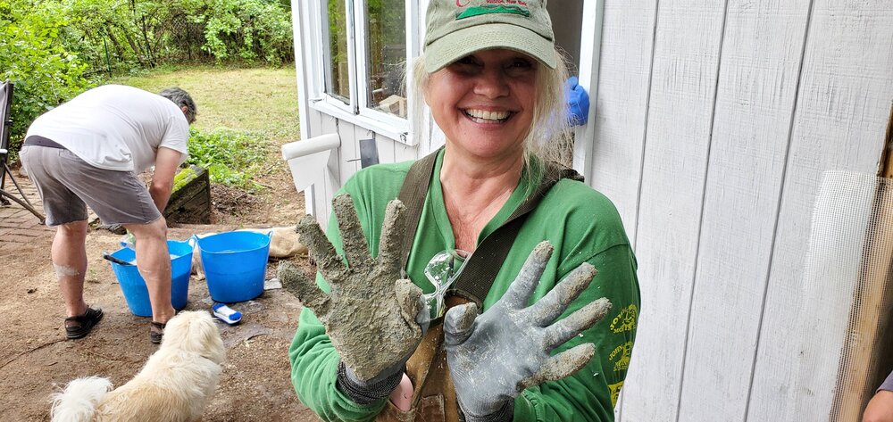 Dee happily shows her Lime Plaster Hands
