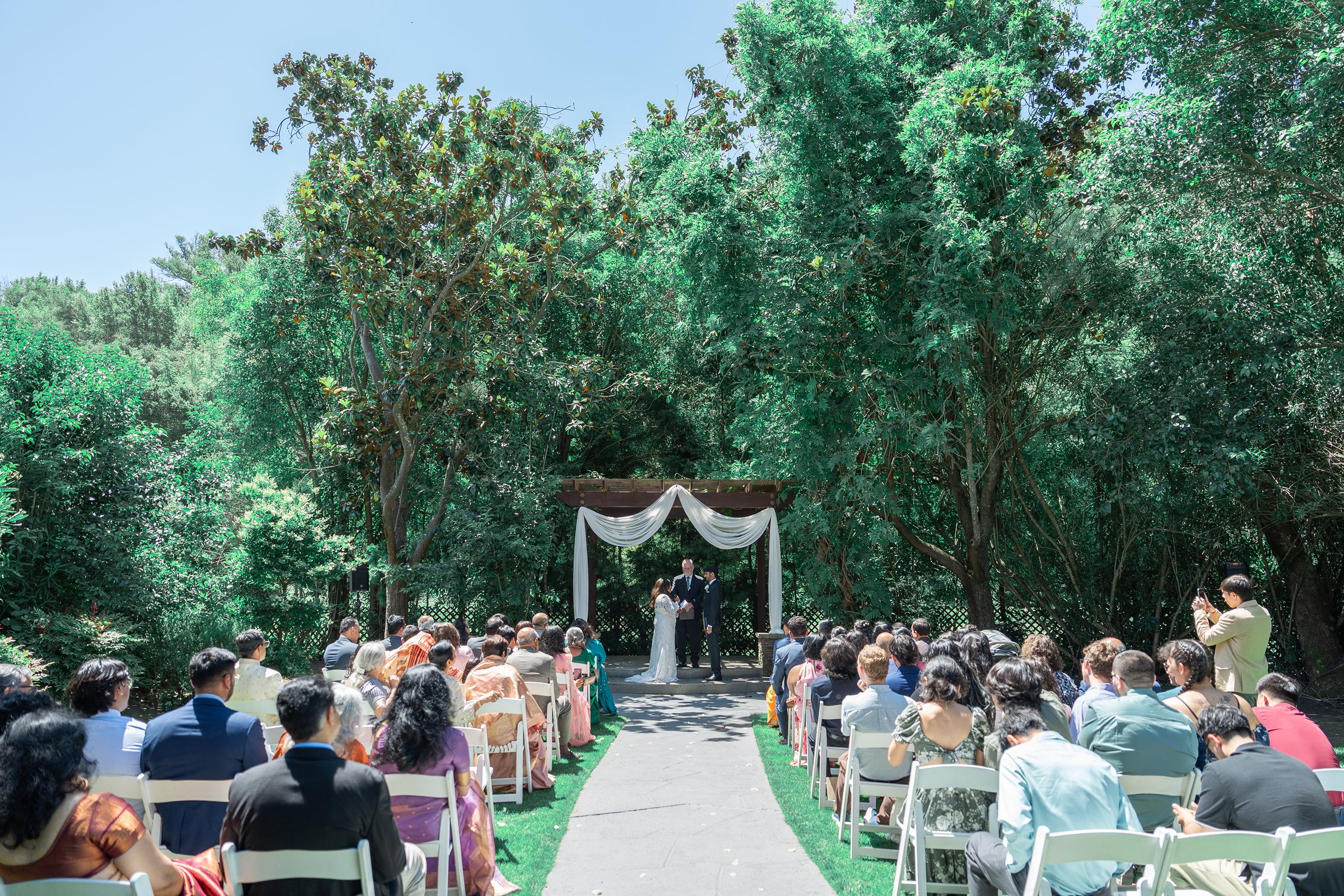 The bride and groom exchanging vows at Redwood Canyon Wedgewood wedding in Castro Valley