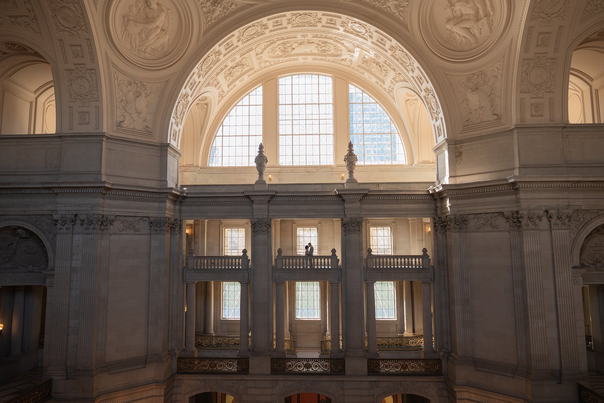 A couple poses for their San Francisco City Hall wedding photos.
