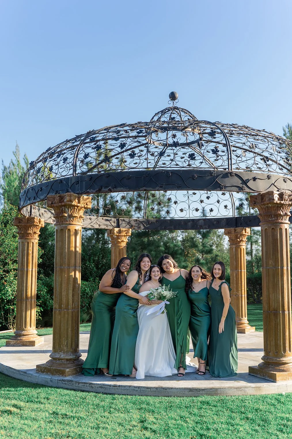 Bridesmaids pose while taking Vellano Estate wedding photos in Chino Hills, CA.
