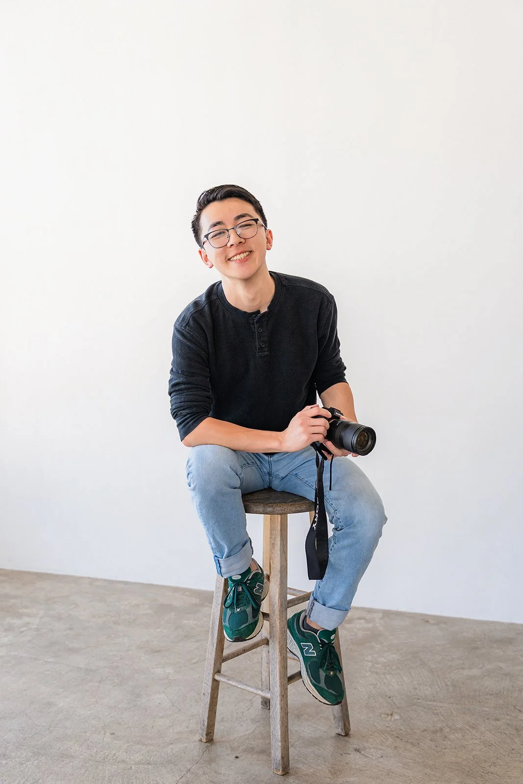 wedding photographer posing for branding photos in downtown LA studio