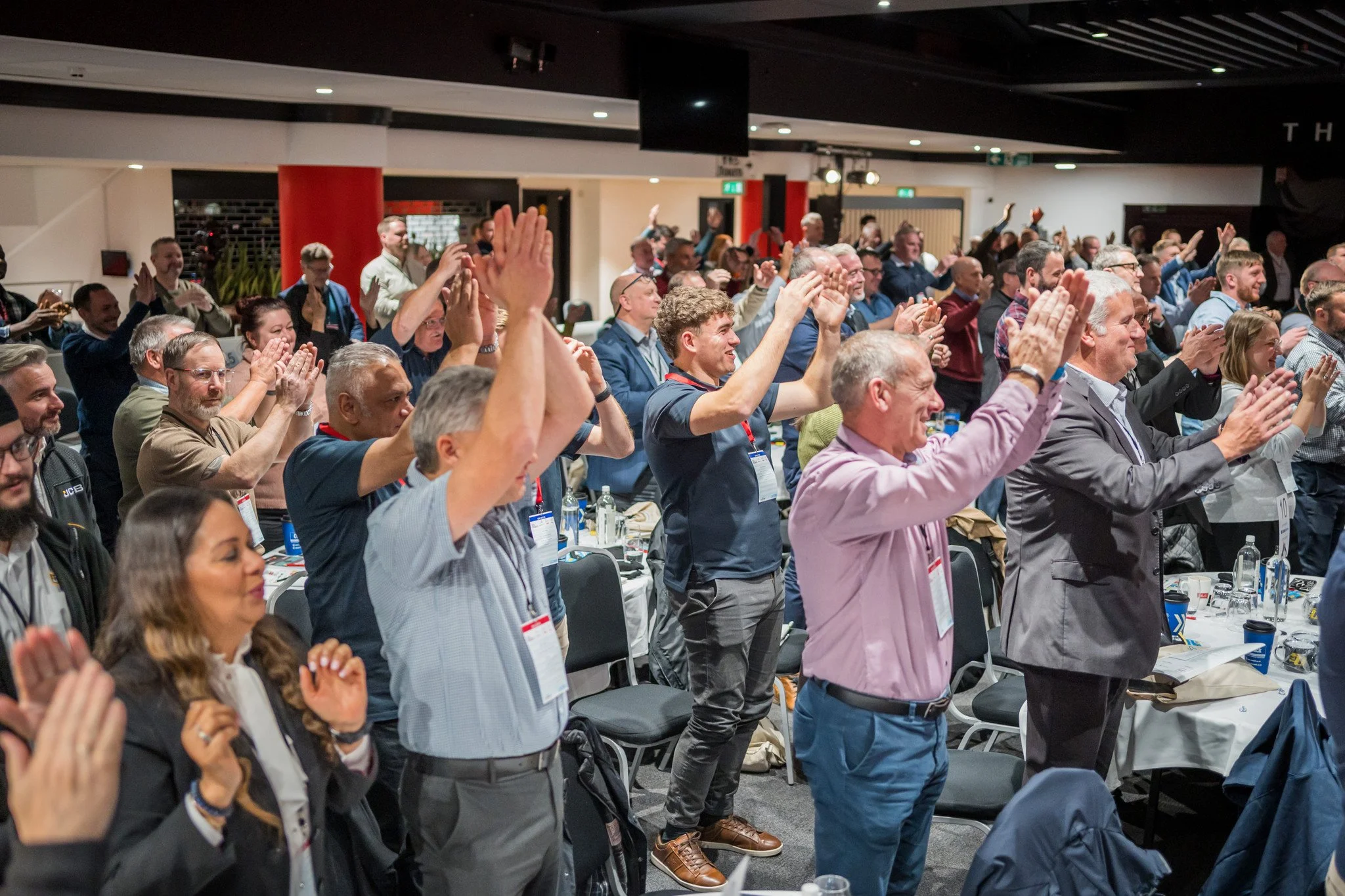 Guy Bloom speaking to audience.jpg