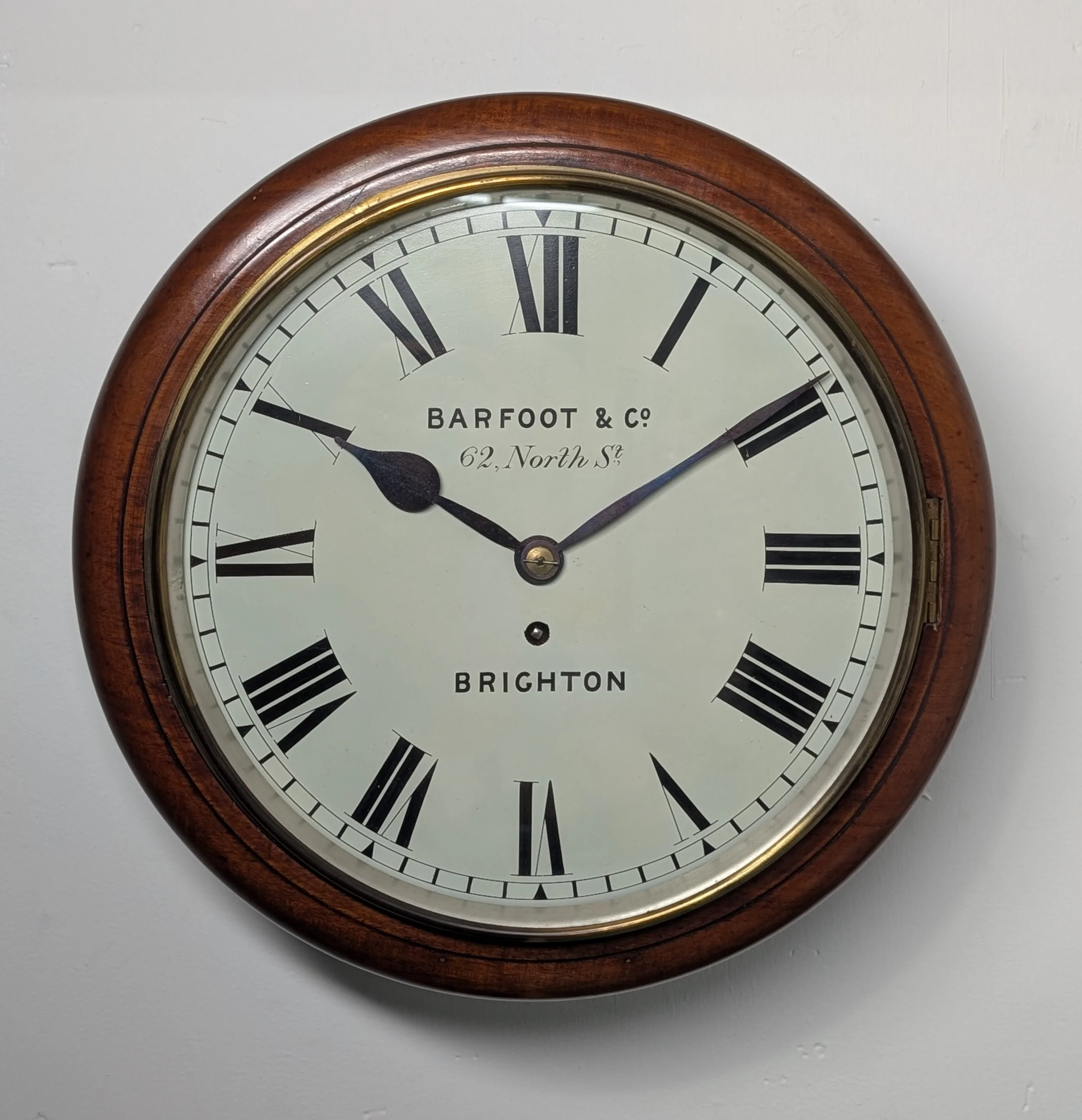 A Mahogany wall clock, school clock, railway clock, post office clock