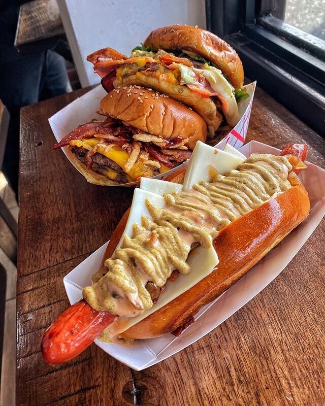 Can&rsquo;t choose between our signature hotdogs or burgers?! Get both. 😉 We&rsquo;re OPEN for delivery and takeout today starting at 11am! #DYCKMANDOGS