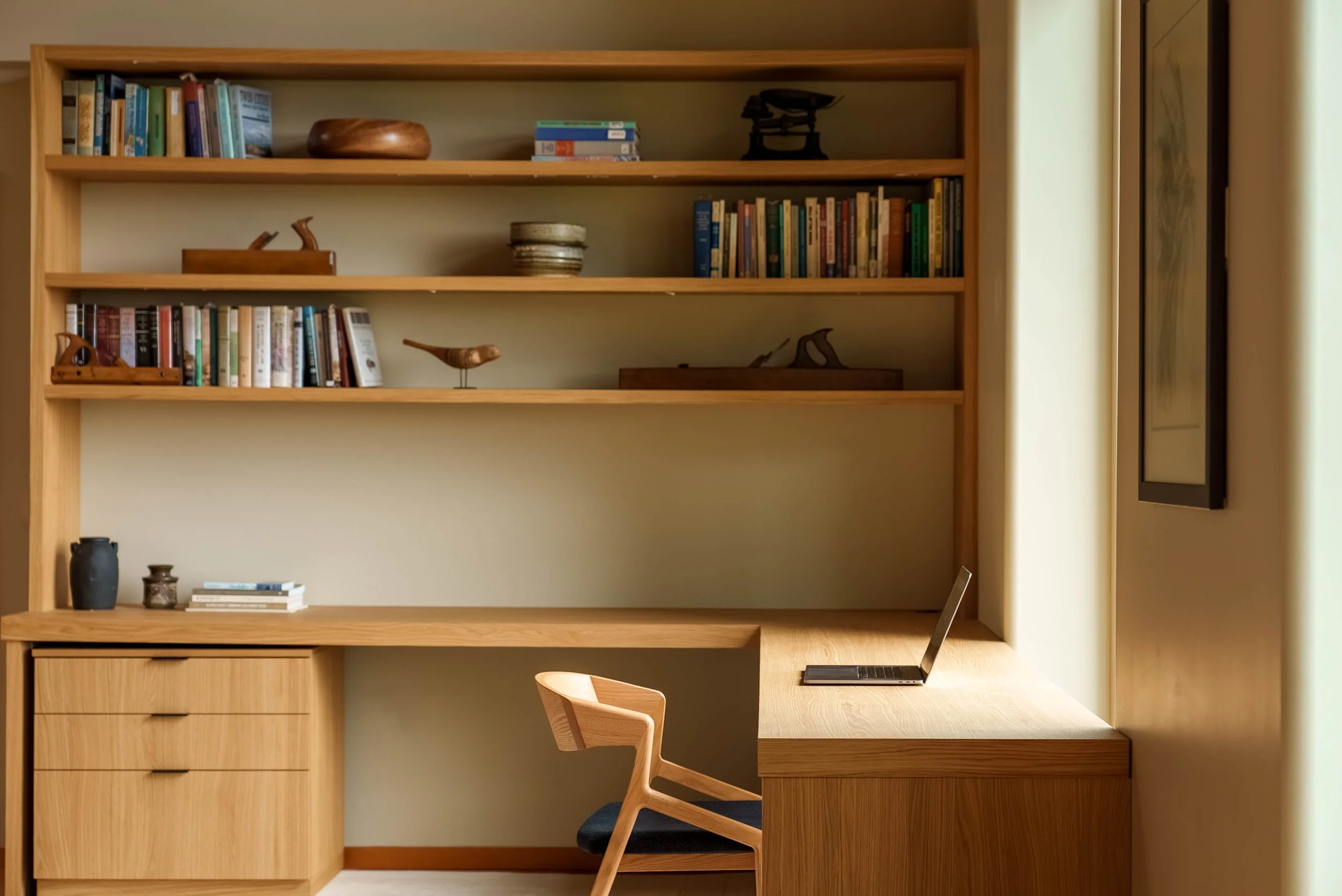 Floating oak desk and minimalist home office overlooking the valley in a Salt Spring Island home