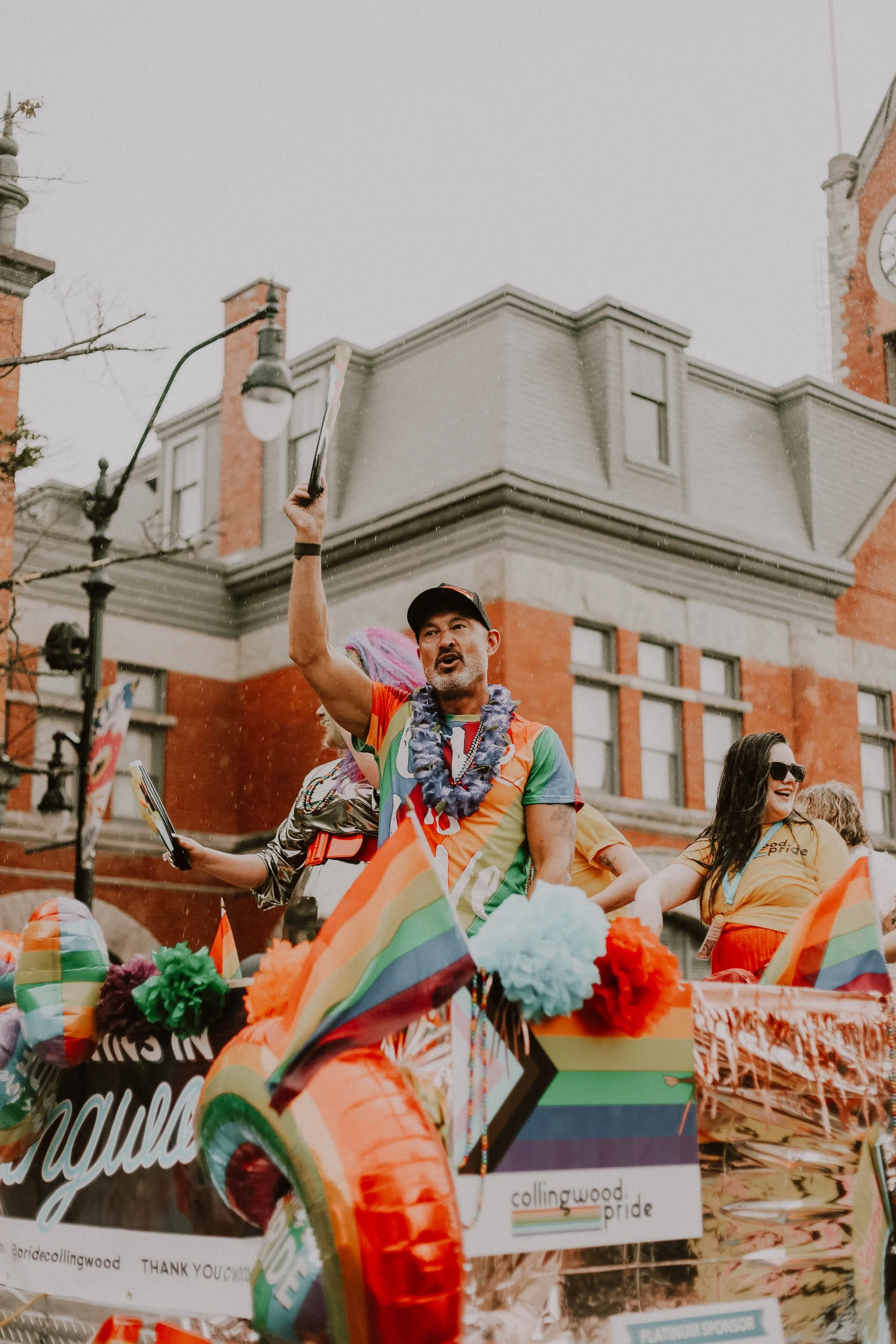 Pride parade float with rainbow flags