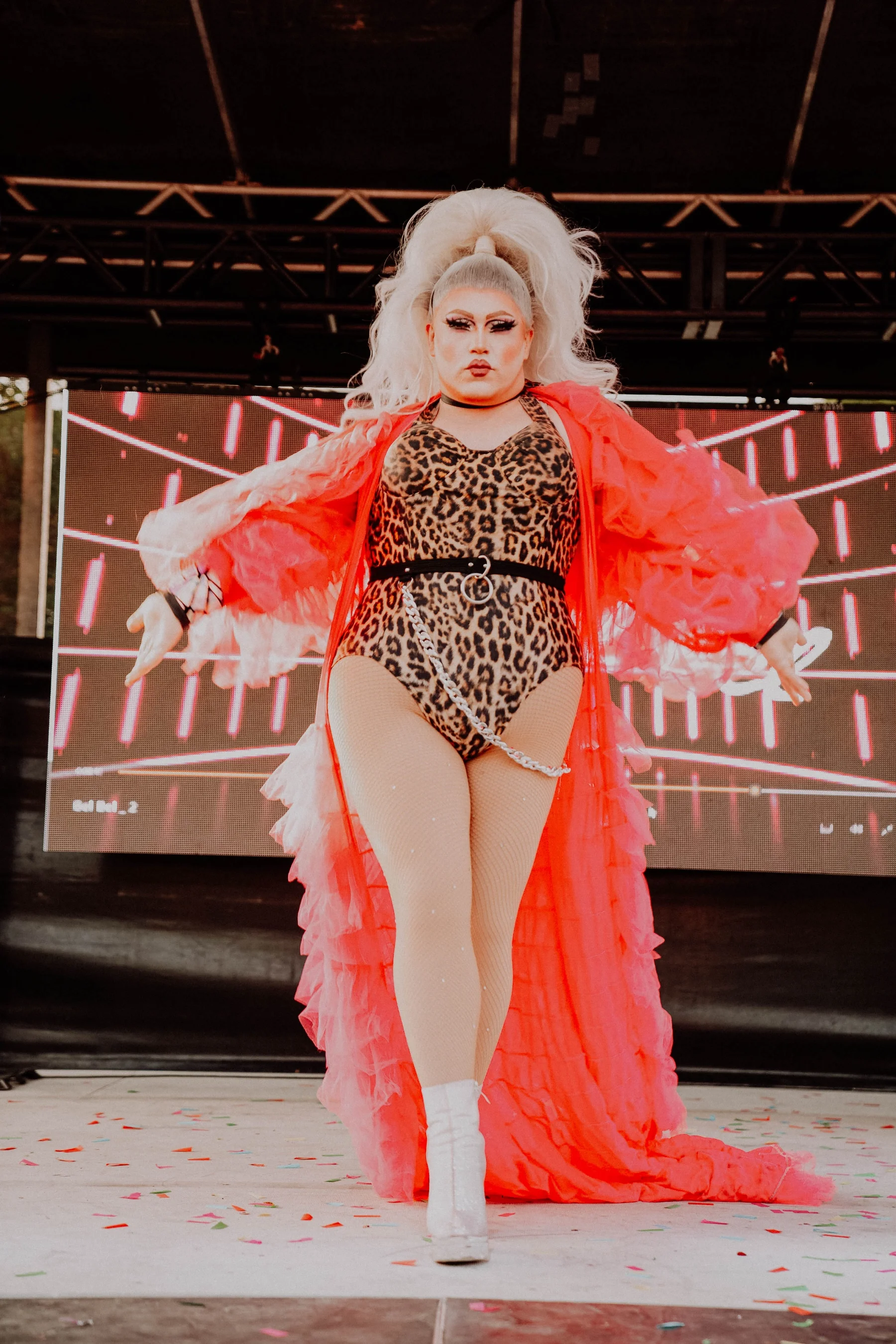 Drag performer in red cape