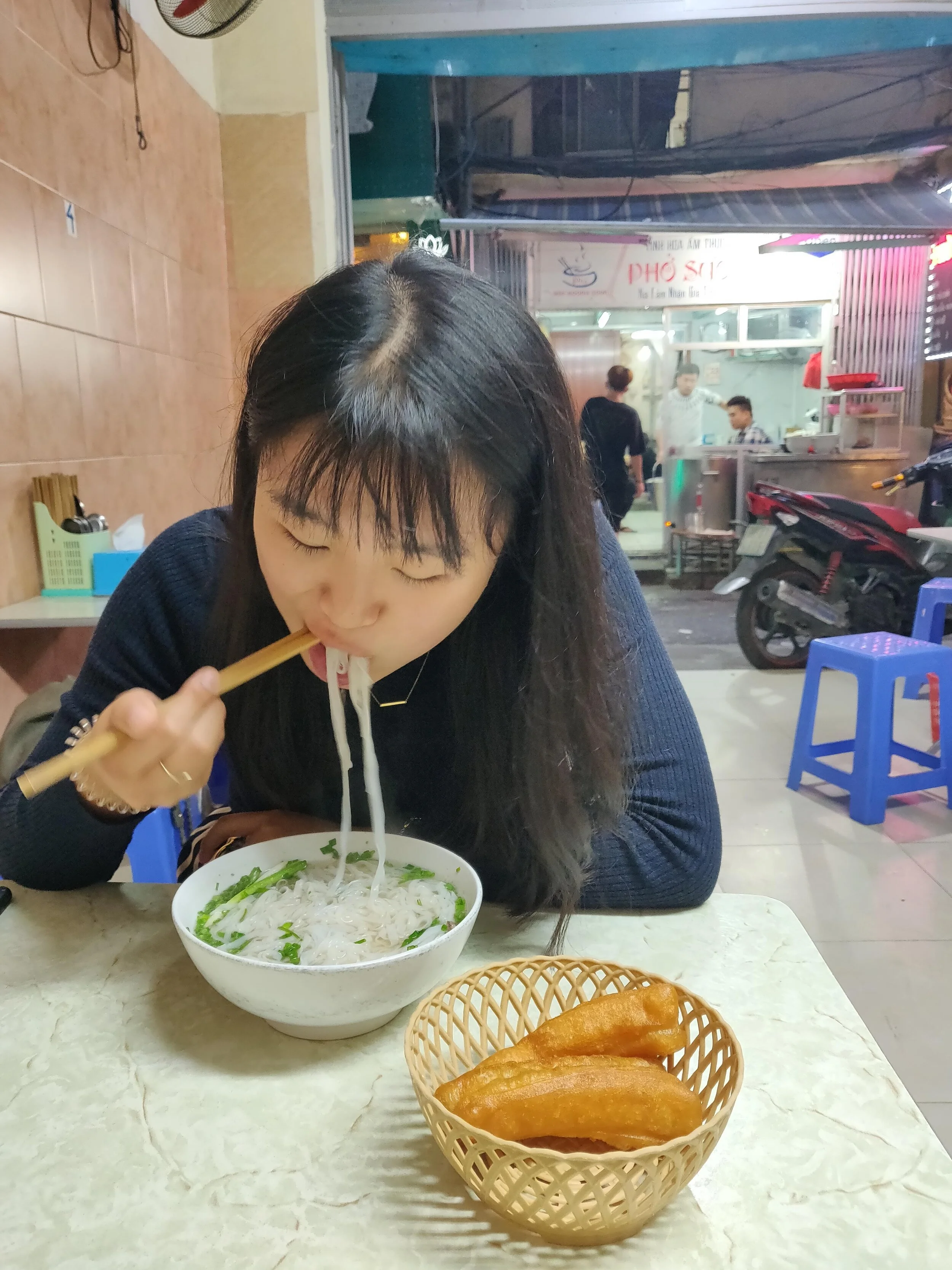 Pho tastes really good with oil stick donuts. Ha Noi, Vietnam.