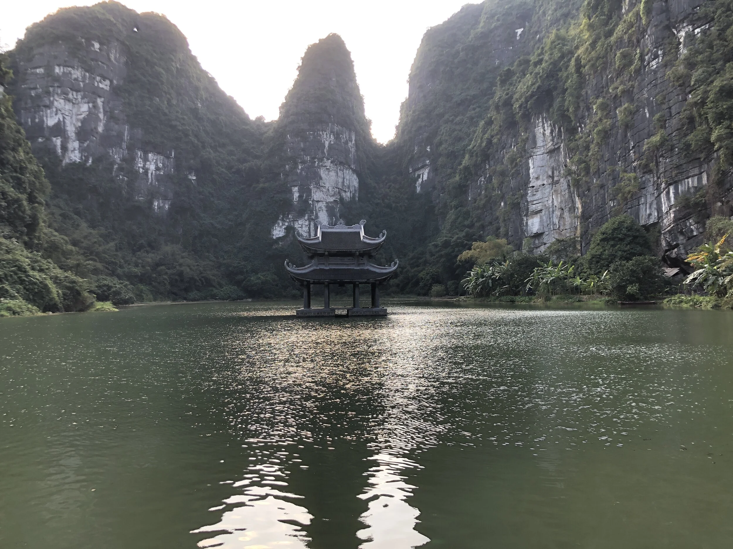 Pagoda on the water in Trang An. Ninh Binh, Vietnam.