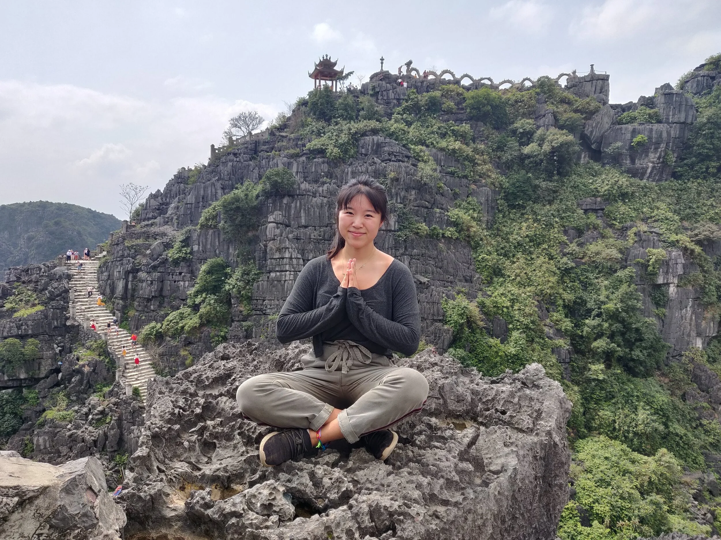 It's actually not comfortable to sit on pointy rocks. Ninh Binh, Vietnam.