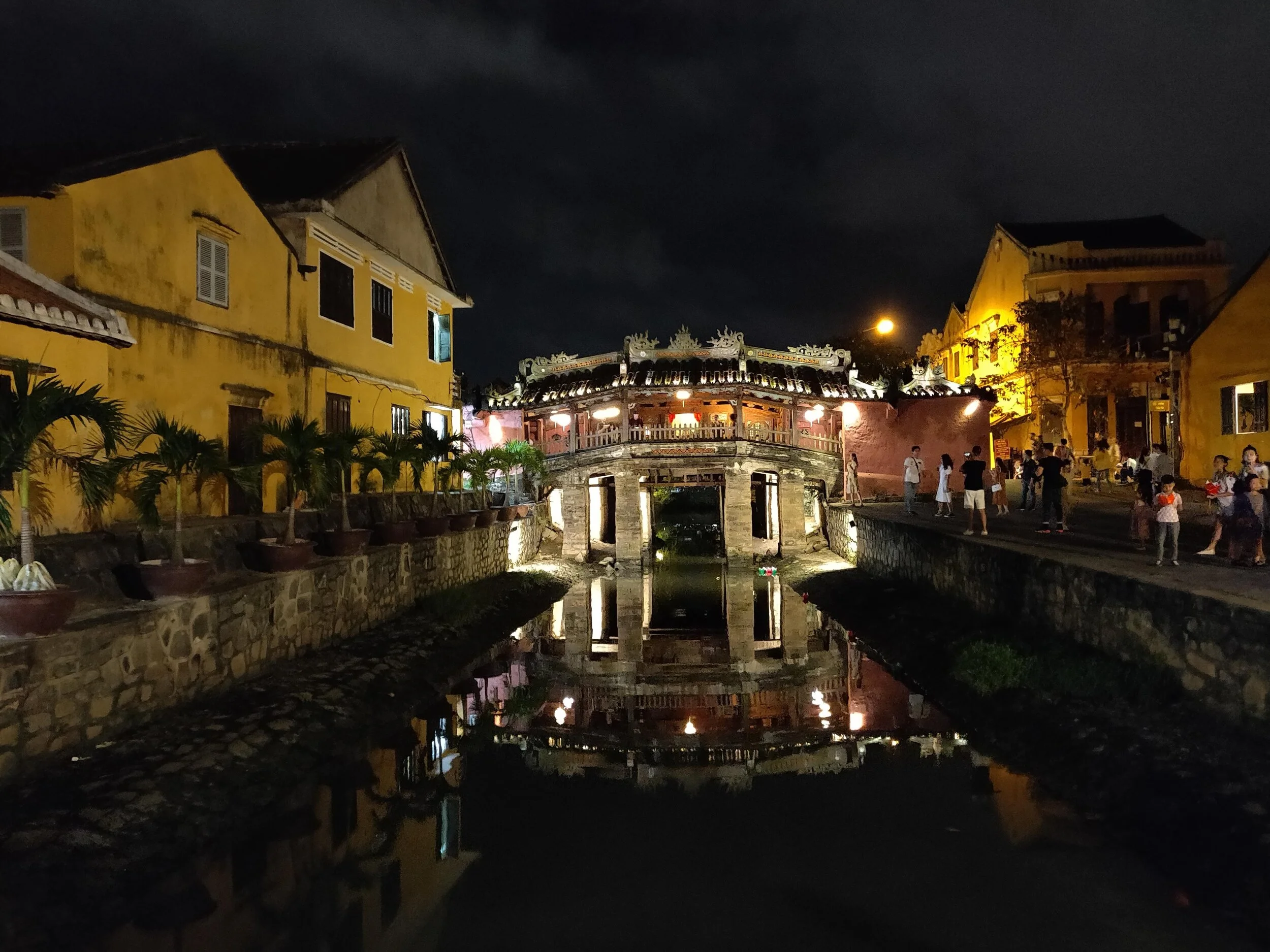 Japanese bridge lit up at night in the city of lanterns. Hoi An, Vietnam.
