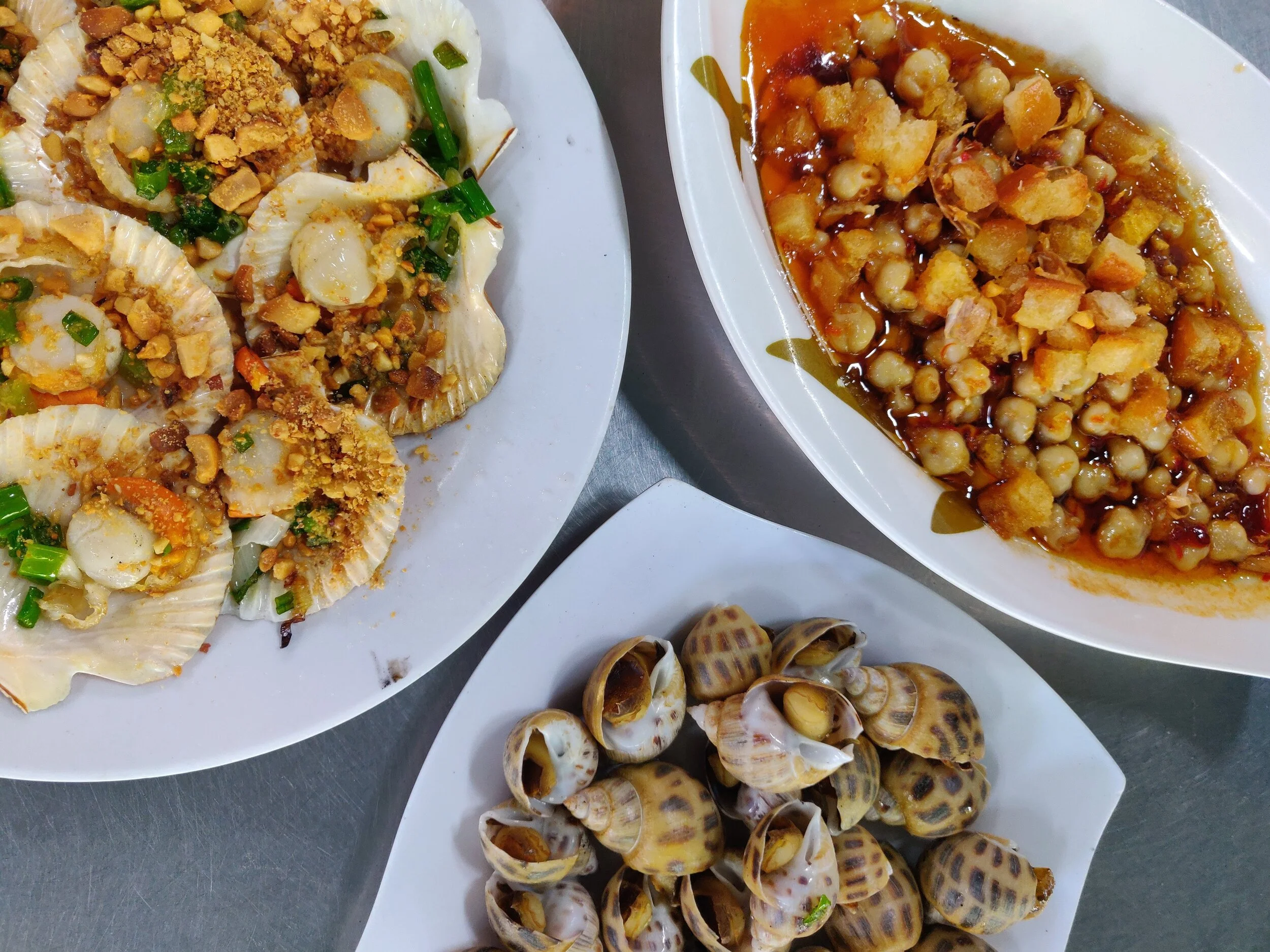 Oc Dao (cockles in butter sauce) are like crack. Saigon, Vietnam.