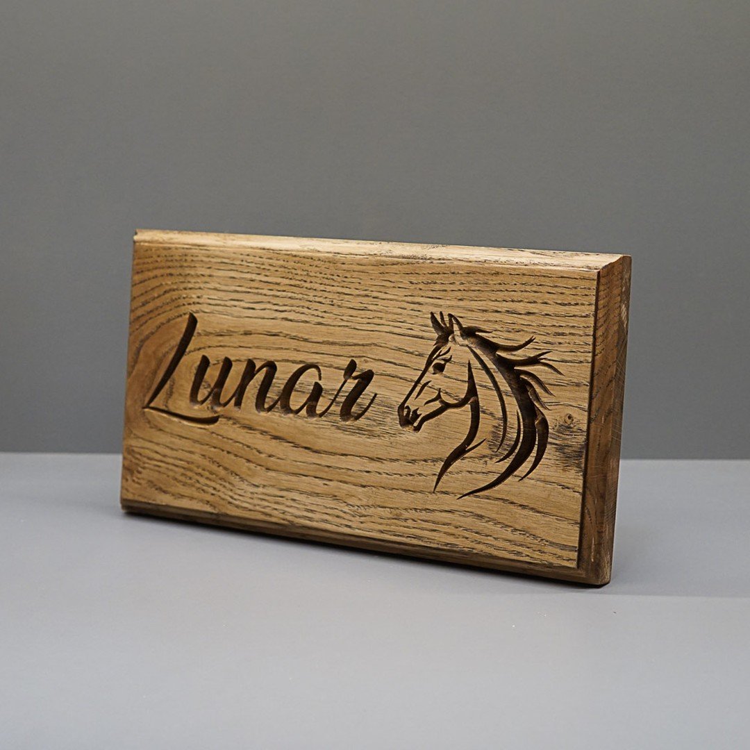 Personalise your own stable name plate with your horses name.

The names plates are made from a single piece of solid oak with the lettering and illustration engraved into the wood.

Finished in a Coat oil to bring out the lovely grain within the Oak