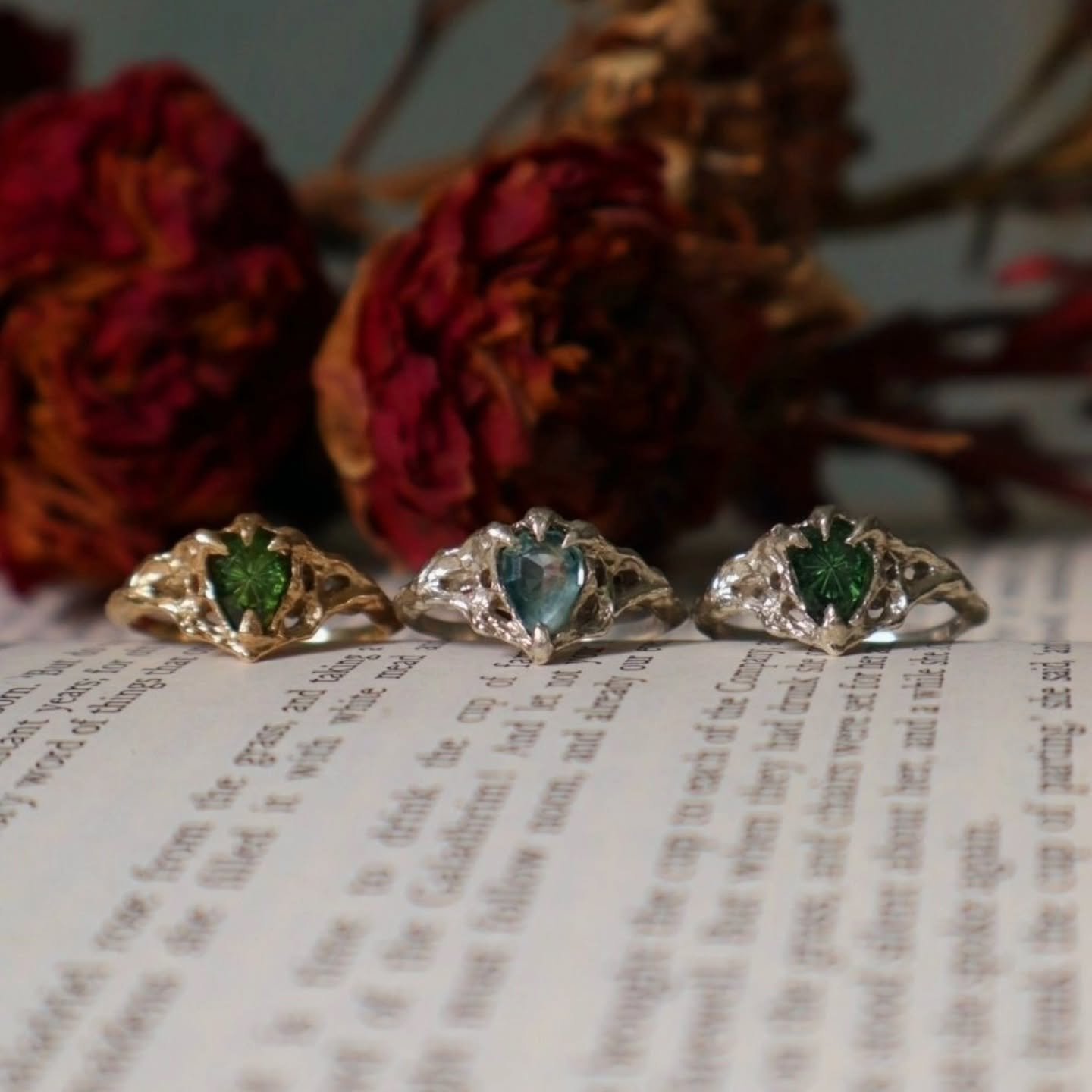 Recently I was lucky enough to have 3 different iterations of the Nocturna Ring in my hands at once - from L - R: 9ct yellow gold, fantasy-cut tourmaline, 9ct white gold, rosecut sapphire &amp; 9ct white gold, fantasy-cut tourmaline ✨️

(The middle o