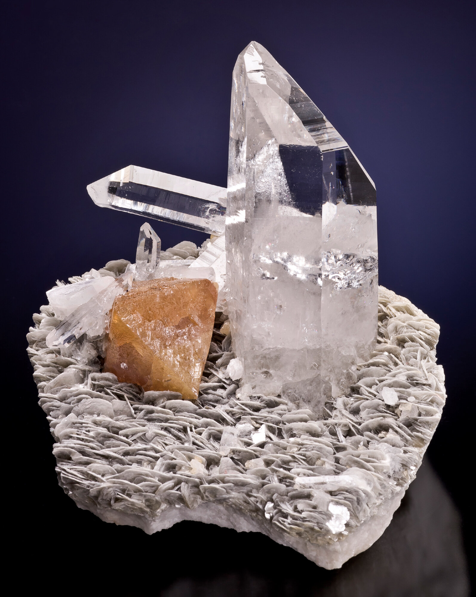  Scheelite with quartz on muscovite, 13 cm, found in the late 1990s; ex Jack Halpern collection, shown in incandescent light, found in 2006; from the Pingwu mine, Huya Township, Mt. Xuebaoding, Pingwu County, Mianyang Prefecture, Sichuan Province, Ch