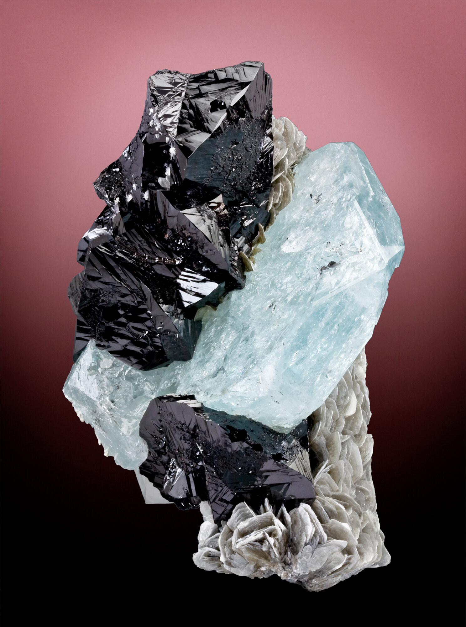  Cassiterite and aquamarine on muscovite, 18 cm, from the Pingwu mine, Huya Township, Mt. Xuebaoding, Pingwu County, Mianyang Prefecture, Sichuan Province, China. Ex Marc Weill collection. 