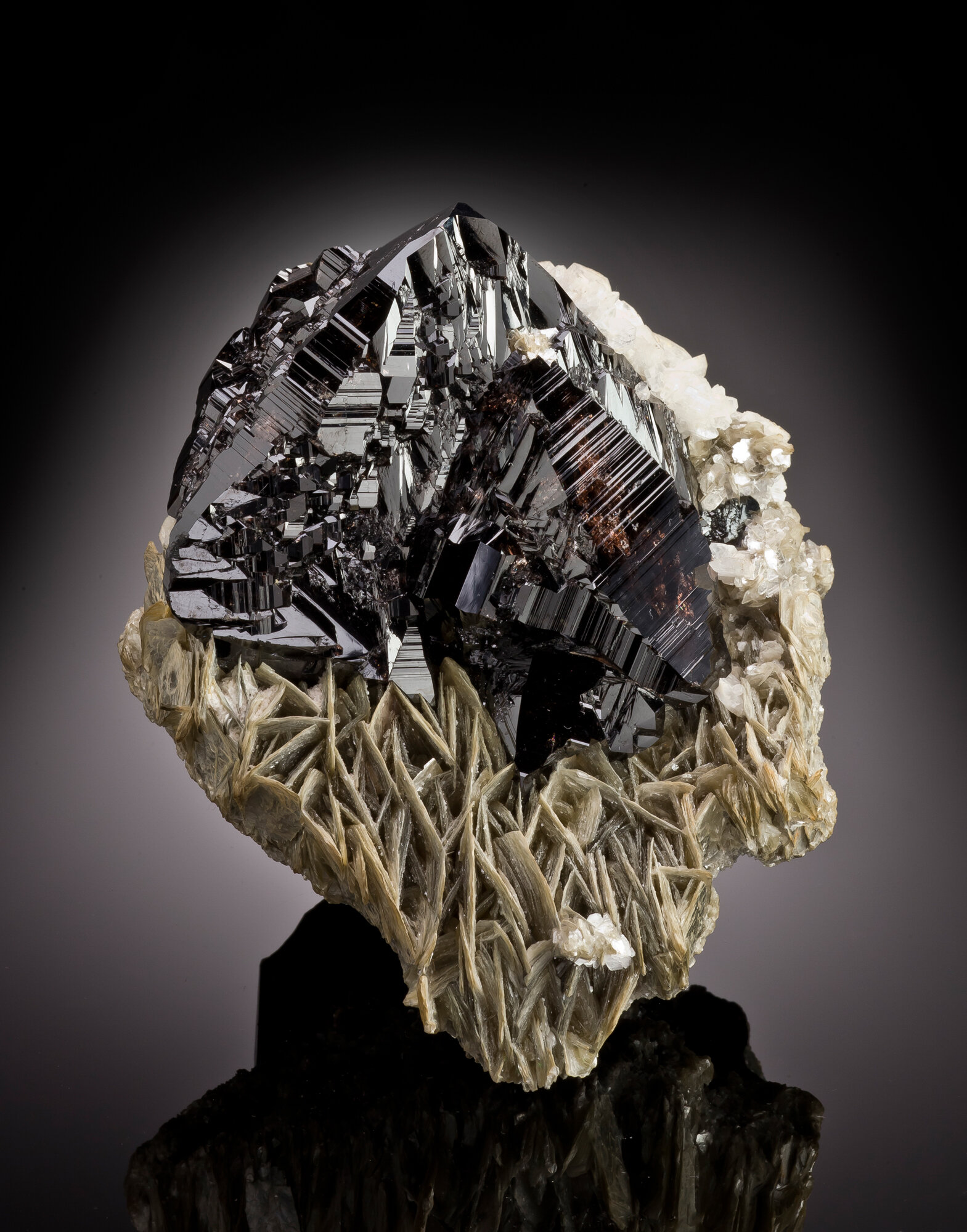  Cassiterite on muscovite, 13.6 cm, from the Pingwu mine, Huya Township, Mt. Xuebaoding, Pingwu County, Mianyang Prefecture, Sichuan Province, China. Found ca. late 1990s; ex Daniel Trinchillo collection. 
