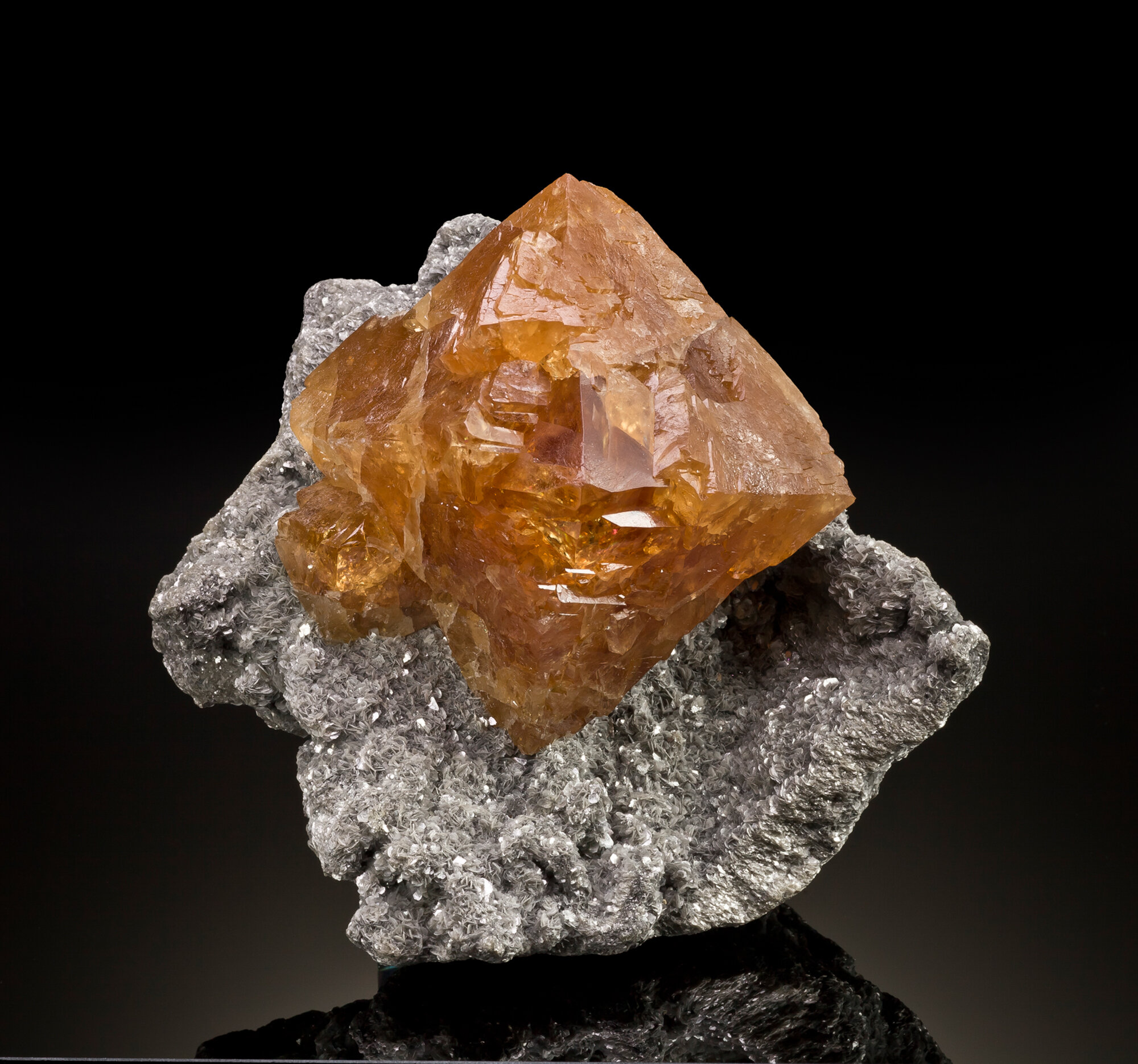  Scheelite crystal on muscovite, 17 cm, from the Pingwu mine, Huya Township, Mt. Xuebaoding, Pingwu County, Mianyang Prefecture, Sichuan Province, China. Found ca. 2000; ex Bruce Oreck collection. 