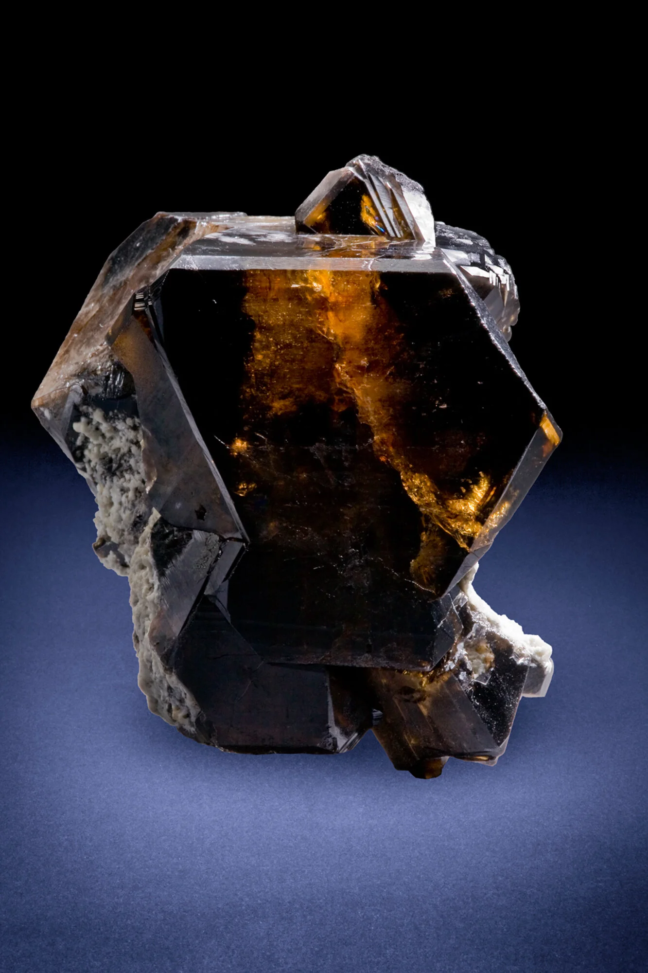 transparent brown cassiterite crystal from the Amo mine, Ximeng County, Yunnan â credit: Crystalline Treasures